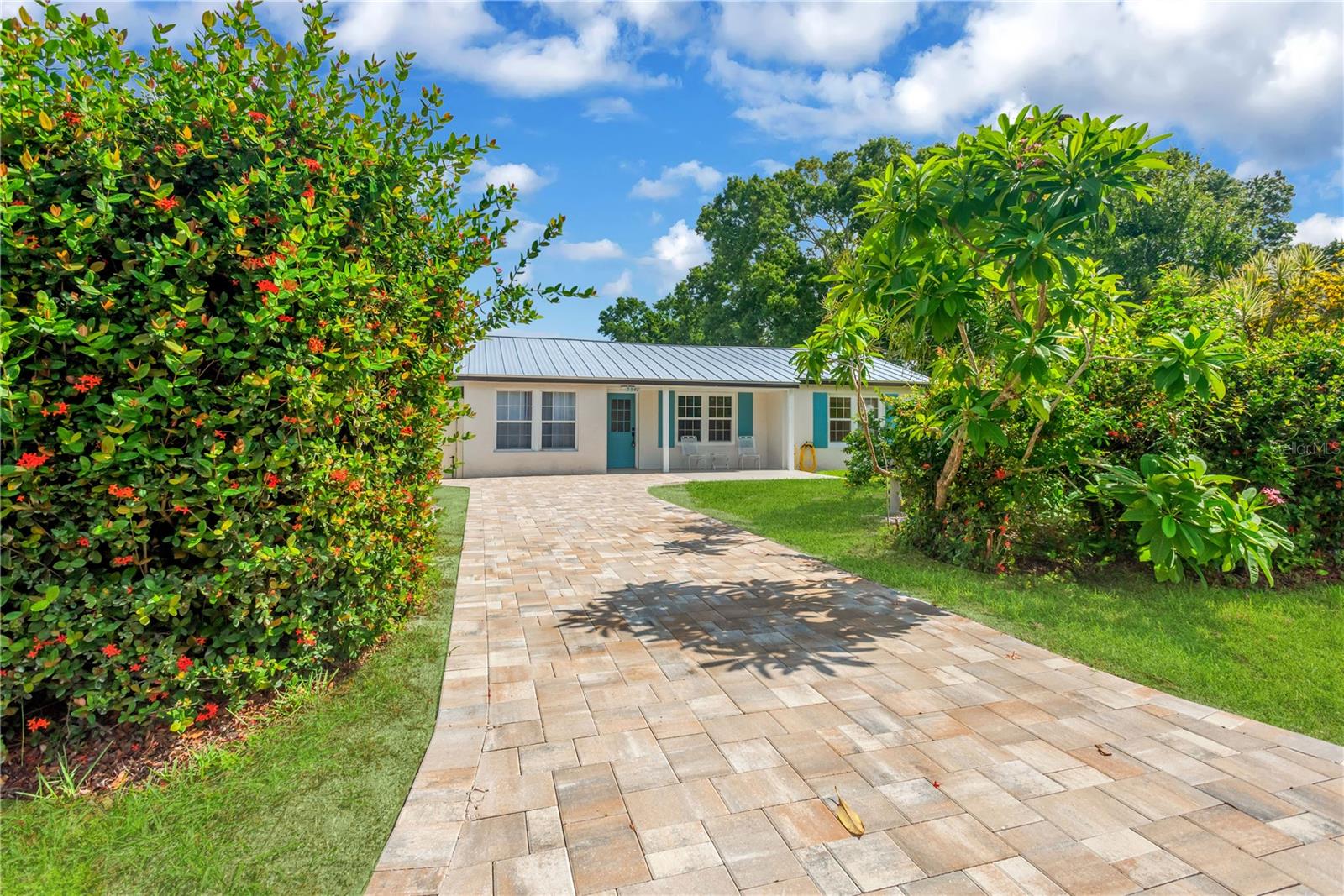 Virtually Staged. Welcome to your dream home in Saint Petersburg! This stunning property with 3 beds and 2 baths, along with a Florida room, offers many upgrades, ensuring comfort, efficiency, and peace of mind for years to come. Step inside to discover brand-new flooring, kitchen cabinets, bathrooms, countertops, and a metal roof, among other updates, all installed in 2026. The open concept layout seamlessly connects the beautiful kitchen and living room area, offering a sleek and modern look. Step outside and unwind in the spacious, fenced backyard—perfect for entertaining, letting pets play, or just enjoying some quiet time. This home is not just a purchase; it's an investment in your future. Don't miss out on the opportunity to call this fully renovated house your home sweet home. Schedule your showing today!