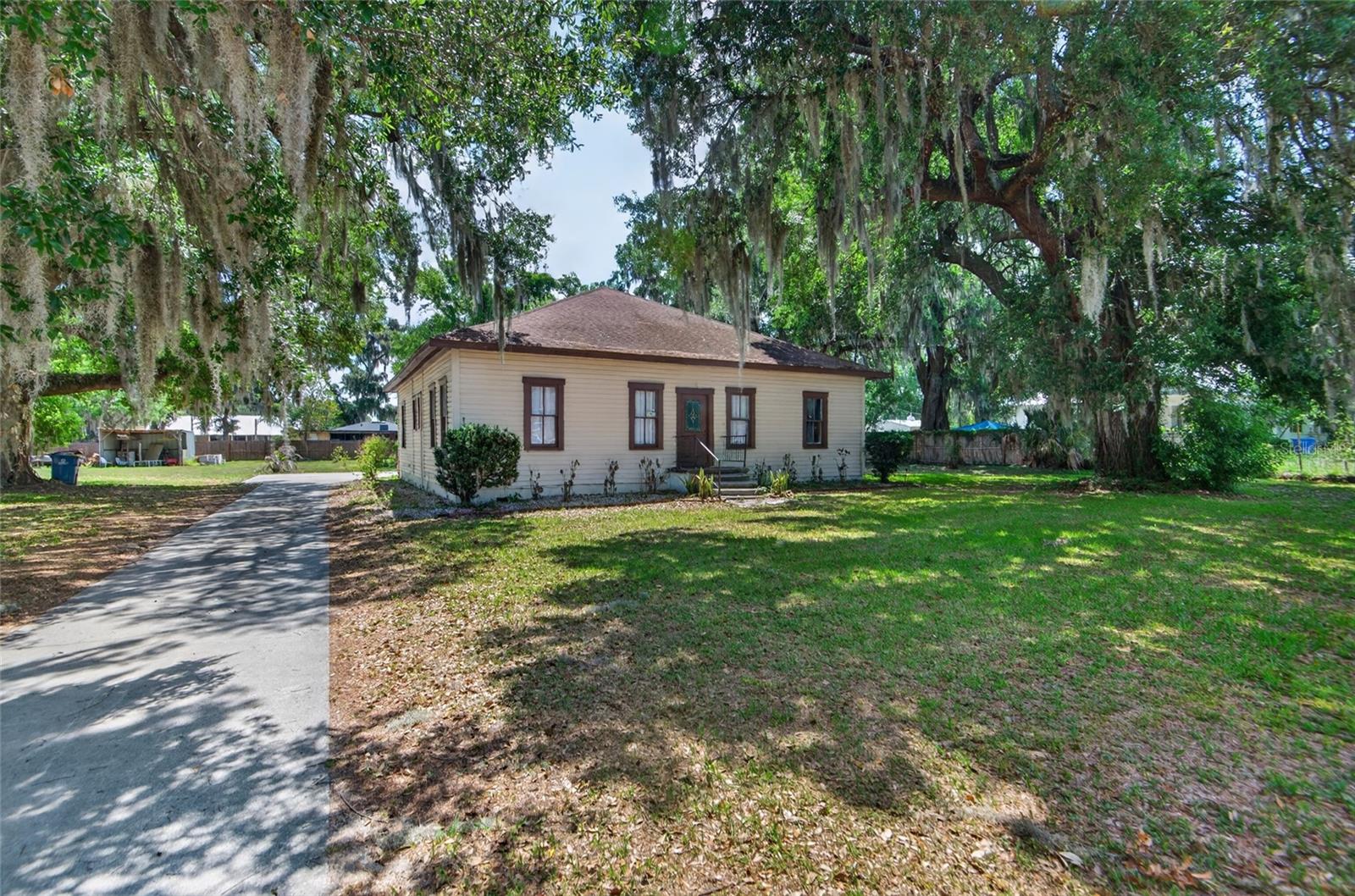 Welcome to 200 N Orange Ave in Fort Meade—a charming historic town known for its peaceful atmosphere and small-town appeal.
Situated on nearly a full acre, the property boasts mature shade trees and ample space for boats, RVs, or outdoor enjoyment. Seller is offering concessions toward the roof, presenting an excellent opportunity for buyers seeking both value and flexibility.
This home offers a spacious, light-filled living room and a functional layout perfect for both everyday living and entertaining. The newly updated kitchen features modern finishes, creating a comfortable and stylish space to gather. Wood floors throughout add to it's original charm.
Recent updates provide added value and peace of mind, including fresh exterior paint, a newly painted living room, and a brand-new carport roof installed in 2024. HVAC replaced in 2019 and a new compressor and fans added in 2024, as well as a water heater installed in 2022.
Enjoy the perfect blend of comfort, space, and quiet living—right in the heart of Fort Meade.
Schedule a private showing today !