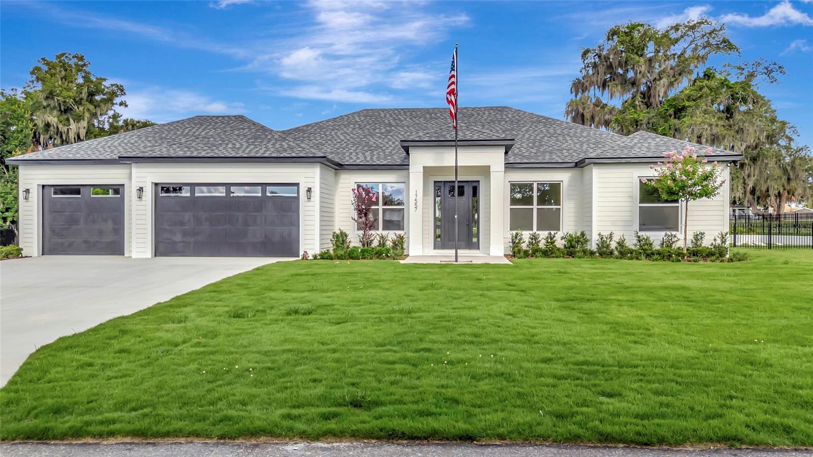 Welcome to this exceptional brand-new construction home in the highly desirable town of Montverde, offering luxury finishes, thoughtful design, and an unbeatable location. Just a short walk to Montverde Academy and minutes from the Florida Turnpike, the new AdventHealth Hospital, and the highly anticipated Crooked Can development, this home combines convenience with small-town charm.

Situated on a spacious 0.40-acre fenced lot, this beautifully crafted residence features 4 bedrooms, 3 full bathrooms, a private den/study, and a formal dining room. The open-concept floor plan is enhanced by 10-foot ceilings throughout, creating an airy and inviting atmosphere. Elegant crown molding accents the main living areas and primary suite, while durable tile flooring extends throughout the home. Every bathroom showcases custom tile work for a refined designer finish.

The gourmet kitchen is designed to impress with upgraded Whirlpool stainless steel appliances, including a range with a built-in air fryer and a vent hood that exhausts to the exterior. Solid wood, soft-close cabinetry is paired with stunning upgraded quartz countertops, creating a space that's as functional as it is beautiful.

The spacious living room features an electric fireplace, perfect for adding warmth and ambiance on those cooler Florida evenings. Two oversized disappearing sliding glass doors open seamlessly to the backyard, creating the ideal indoor-outdoor living experience.  Plenty of room to add a swimming pool and/or shop.  Upgraded landscaping and citrazoy grass.

The luxurious primary suite and all secondary bedrooms include custom closet built-ins, with every bedrooms,  ceiling fans and lighting outlet above the closet shelf.

Car enthusiasts, boat owners, and hobbyists will appreciate the oversized 3-car garage, including a drive-through bay with direct access to the backyard through a gated fence—perfect for storing a boat, trailer, or recreational equipment.

Built with energy efficiency and peace of mind in mind, this home includes upgraded R-38 blown-in attic insulation, Low-E white vinyl windows, a built-in HomeTeam Pest Defense in-wall pest control system, and a Sentricon termite protection system with a one-year bond already in place.

Best of all, enjoy the freedom of NO HOA and NO CDD fees. From the American flag proudly flying out front to the quality craftsmanship found throughout, this home offers the perfect blend of luxury, comfort, and practicality in one of Central Florida's most sought-after communities.
