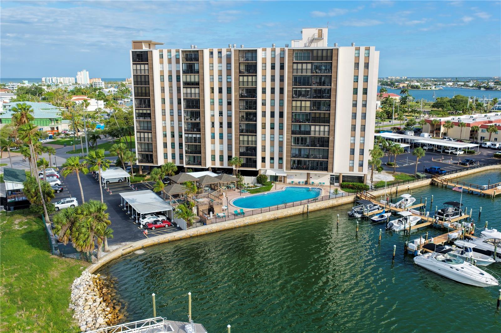 One or more photo(s) has been virtually staged. Wake up to breathtaking views of the Intracoastal Waterway from this 9th-floor condo in the highly desirable Paradise Island Towers community. HVAC new in 2021. This 1-bedroom, 1-bath residence offers 865 square feet of comfortable living space, in-unit laundry and an unbeatable location just minutes from Treasure Island's beautiful beaches, restaurants, shopping, and entertainment. Enjoy peaceful mornings and stunning views from your private balcony overlooking Boca Ciega Bay. Recent updates include newer dryer, electric hurricane shutters, and an additional private storage unit on the same floor. Residents enjoy a heated waterfront pool, spa, fishing pier, clubhouse, shuffleboard courts, and marina access. Whether you're looking for a year-round residence or a coastal retreat, this waterfront condo offers the best of the Treasure Island lifestyle. Schedule your private showing today!
