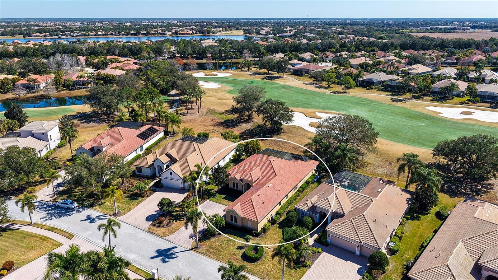 Welcome to upscale living in the exclusive and gated Lakewood Ranch Golf & Country Club in this custom-built Caterina III home by Gibraltar. With its beautiful curb appeal, this home is in the maintenance-included enclave of Mizner Reserve with three bedrooms, 2.5 baths, an office/den, living room, dining room, family room and a two-car garage with an expansive parking pad, all filled with bright sun spaces. An abundance of crown molding can be found in many of the rooms and in some with architecturally designed tray ceilings, double crown molding is displayed, along with ceiling fans in several rooms. The gourmet kitchen offers a separate island and a breakfast bar, both with granite surfaces and lots of counter space and it is included in the heart of the home area with the adjoining family room. The eat-in kitchen area sits by a large aquarium window overlooking the pool and lanai with the golf course background. Relaxation and unwinding are best done on the beautiful and private rear lanai, which offers covered and non-covered areas, a barbecue grill and wine refrigerator for entertaining. The sparkling saltwater and heated pool and the heated spa are on two separate heaters, which allows you to heat only the one you are using. An added convenience is the half bath has direct access to and from the pool area. The entire lanai area’s view is enriched by the views of the undulating fairway of the Cypress links golf course. The owner’s suite boasts some views from its windows and includes a high tray ceiling and double crown molding, with two spacious walk-in closets. The owner’s suite bath offers two separate sinks, a walk-in shower and a separate soaking tub. Guests will enjoy two ample-sized bedrooms in a separate wing of the home. The windows in the dining room, ideal for family gatherings, are enhanced with plantation shutters and remaining windows in the home have shade treatments. There is also a large laundry room with a sink and wood cabinetry. Your guests will have plenty of space on the parking pad in front of the home. Another appealing feature of the home is its proximity to one of the five access gates. The country club offers voluntary membership in several levels of amenities, including the golf membership boasting four golf courses. Other CC amenities include a pool, tennis, pickleball, restaurants and an awesome exercise center. Nearby are pristine and award-winning beaches, the new Mote Aquarium, fine and casual dining, medical facilities and proximity to many cultural venues of Sarasota.