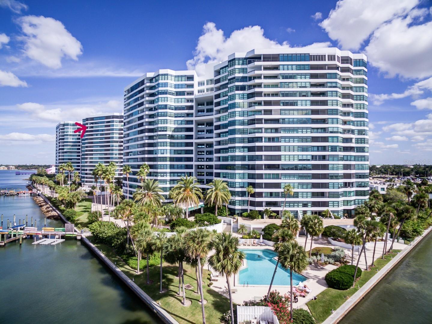 A beautifully appointed 2-bedroom, 2-bathroom condo perched on the 17th floor with sweeping bay and sunset views.  This light-filled residence offers an open-concept layout, spacious bedrooms, and floor-to-ceiling sliders that showcase stunning Bay and Gulf views. Enjoy morning coffee or evening sunsets from your private balcony overlooking the bay. Boating enthusiasts will appreciate the dock slips just out your front door and easy water access, while downtown dining, shopping, entertainment, and nightlife are just minutes away. Combining waterfront tranquility with urban convenience, this condo delivers the perfect blend of luxury, comfort, and location. The primary ensuite is separated from the living area by barn doors. The adjacent ensuite has closets galore and a walk in shower with dual sinks. The spacious guest bedroom features ample closet space and an adjacent bath with a walk in shower and linen storage. The kitchen is open to the living area with a breakfast bar, SS appliances, plenty of storage and a tray ceiling with custom art.  At Condo on the Bay you can enjoy the resort style pools and lifestyle, fish off the pier,  keep your boat or kayak out your front door and watch the dolphins play.  At the same time all the benefits of living downtown are just a short walk away. Concerts, art festivals, restaurants, the performing arts theatre, walking trails, movie nights are just across the street or a couple blocks away. Lido beach is just 2 miles away and the airport 4 miles. You can feel safe and secure as Condo on the Bay is on it's own gated peninsula with 24 hr security and a concierge from 8-6 everyday.  Walk out your back door to play tennis or pickleball. Want to make friends? there are many organized social activities to participate in. Your HOA fee covers everything except the eletric bill. Boat slips are available for lease to owners. Offers should include proof of funds or pre-approval.