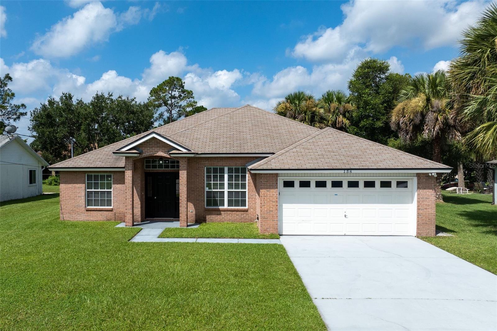 Charming 3-bedroom, 2-bath property for sale located in Palm Coast !This well-maintained home features a spacious living area with a cozy fireplace, stainless steel appliances, a 2-car garage, and an oversized lot with plenty of room to enjoy the outdoors. Upon entry , extra space on both sides can be used as a sitting room , full dining room or an office. Both guests room have large closets and a split floor plan allows for maximum privacy. This can be an excellent starter home ! Conveniently located near shopping, dining, top rated schools, parks, and just minutes from multiple beaches. Don’t miss this wonderful opportunity to own a beautiful home in a great location!