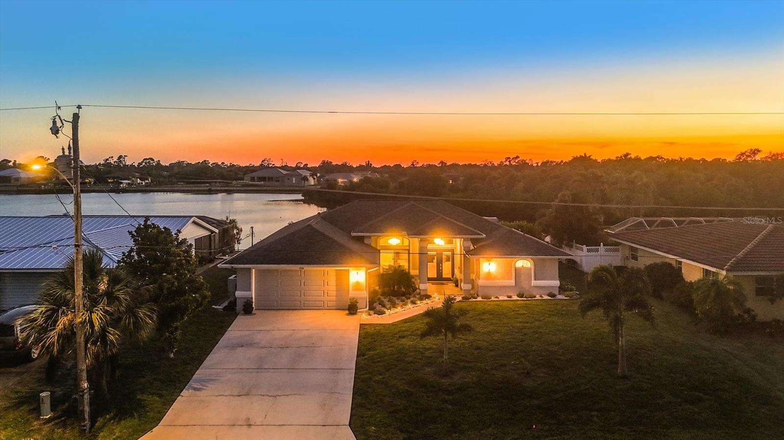 Stunning SALTWATER FRONT HOME – with PREMIUM LUXURY FINISHES - No Deed Restrictions.
Welcome to your slice of Florida paradise! This exceptional saltwater front home with new Heated Luxury SALTWATER POOL & SPA, has been completely renovated to the highest standards, offering an immediate sense of luxury and charm. With striking curb appeal and countless decorator upgrades, this home is a true showstopper.
Step through double impact-glass entry doors into a space designed for comfort and style. The gourmet kitchen is a chef’s dream, featuring quartz countertops, brand-new stainless-steel appliances, a subway tile backsplash, and custom soft-close real wood cabinetry with abundant storage plus a large Island.
The home boasts elegant luxury vinyl plank flooring throughout and offers two spacious living areas, a bright dining room with  custom WAINSCOTTING, and breathtaking water views that create an inviting atmosphere for entertaining family and friends.
The split-bedroom floor plan includes:
• Zen-inspired master suite with private lanai access, a walk-in closet, and a spa-like ensuite bathroom featuring a double vanity with lighted glass mirrors and a stunning walk-in shower.
• Two well-appointed guest bedrooms with deep closets, upgraded fans, and a shared luxurious bathroom adorned with custom cabinetry and designer tilework.
Step outside to the patio, the perfect space for morning coffee or evenings under the stars. Enjoy the serene views of your saltwater oasis, complete with a new dock, 10,000-pound boat lift, and electric service. With only a 7-minute boat ride to the PEACE RIVER, with GULF ACCESS, this property is ideal for boating and fishing enthusiasts. 
Additional Features:
• Impact double pane glass windows and sliders for effortless indoor-outdoor living.
• Inside laundry room with extra cabinetry and counter space.
• New Saltwater Pool and Spa, for the ultimate Florida Lifestyle.
•  NEW RITE POOL HEAT/COOLING PUMP (10/2025),
• Public Water and Sewer, plus a Well for irrigation.
• Newly sodded, landscaped and fenced yard. 
Located just minutes from beaches, historic Punta Gorda, Sunseeker Resort, golf courses, fine dining, medical facilities, and the airport, this home offers unparalleled convenience and tranquility.
Enjoy private wide water views where manatees, dolphins, and fish make regular appearances. Don’t miss the opportunity to own this piece of waterfront paradise! The Port Charlotte area was VOTED #1 PLACE TO LIVE by CNN and MONEY magazine and featured in the TOP PLACES TO RETIRE in WHERE TO RETIRE magazine.
Schedule your private tour today!