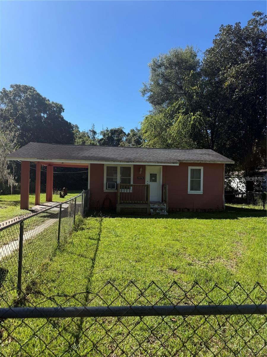 This cozy 1/1 home offers comfortable living with tile floors throughout and a functional layout. Enjoy peace of mind with a fully fenced yard—
perfect for pets, gardening, or outdoor entertaining. Situated on a generous .32-acre lot, there’s plenty of space to expand or relax. Includes a
covered carport for convenient parking. Located close to schools and shopping, this home combines comfort and convenience in a great location!
