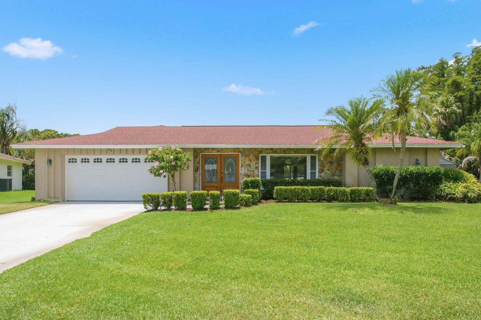 Welcome to your private retreat in one of Palm Harbor’s most desirable 55+ communities, nestled in the highly sought-after East Lake Corridor. This exceptional 2-bedroom, 2-bathroom home offers an oversized 2-car garage, a rare private swimming pool - one of only three in the entire community, and a spectacular .35-acre homesite backing directly to the natural beauty of John Chesnut Park. From the moment you arrive, the home's impressive curb appeal and elegant wood and leaded-glass double entry doors create a warm and inviting first impression. Inside, a bright tiled foyer opens to a spacious living and dining area, where French doors lead seamlessly to the expansive lanai and pool, creating the perfect setting for indoor-outdoor living. The centrally located kitchen is ideal for entertaining, featuring white cabinetry, stainless steel appliances, and easy access to both living spaces. The generously sized family room showcases stylish wood-look tile flooring and two sets of French doors that open to the outdoor oasis beyond. The private primary suite is a true sanctuary, complete with French doors to the lanai, a walk-in closet, and an updated en-suite bath featuring a large walk-in shower and marble-topped vanity. A split-bedroom floor plan provides privacy for owners and guests alike, with the spacious secondary bedroom offering dual closets and convenient access to the second full bathroom. Step outside and discover what truly sets this property apart. Surrounded by nature and backing directly to John Chesnut Park, you'll enjoy daily visits from deer, tropical birds, and native wildlife, creating a peaceful and picturesque setting. The sparkling Pebble-Tec pool is surrounded by an expansive deck and enclosed within a screened birdcage, providing the ultimate space for relaxation and entertaining year-round. A separate vinyl-fenced area offers a secure space for pets to roam freely, while a large storage room on the lanai provides ample space for pool equipment and outdoor essentials. Additional highlights include a well for irrigation, an oversized garage with attic access, abundant storage, and an included washer and dryer. Active 55+ community offers a large pool & clubhouse and very low HOA fees. Residents can enjoy a stroll to John Chesnut Park’s scenic trails, dog park, playgrounds, picnic shelters, and beautiful Lake Tarpon, one of Florida’s premier freshwater lakes. Conveniently located near shopping, dining, golf courses, medical facilities, airports, and the Gulf Coast’s world-famous beaches, this home offers the perfect blend of comfort, convenience, and natural beauty. Rarely does an opportunity like this come along. Experience the Florida lifestyle you've been dreaming of and make this exceptional property your next home