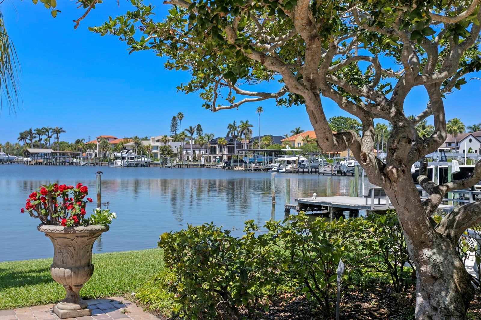 **Iconic Waterfront Estate on Brightwaters Blvd on an Oversized lot with Direct Access to the Open Bay** Welcome to 321 Brightwaters Blvd NE, a rare and expansive waterfront estate in the heart of Snell Isle. Set on a 0.41-acre oversized lot with 140 feet of water frontage, this one-of-a-kind property offers an unmatched blend of sophistication, luxury, and downtown convenience. Boaters will appreciate the direct, bridge-free access to open Tampa Bay waters—ideal for sailboats and larger vessels alike. The residence is a thoughtfully preserved architectural treasure with intricate details inspired by Venetian palazzos. Originally designed by the esteemed S.V. Schooley, architect for C. Perry Snell, and constructed with terra cotta block for exceptional longevity, this Mediterranean Revival masterpiece blends timeless design with modern comfort across more than 5,300 square feet of elegant living space. The property is gated and fenced, providing additional privacy and tranquility. Rich in character with spectacular water views, the home features soaring arched windows and passageways, intricate hand-painted Italian-inspired accents, and three fireplaces that add warmth and ambiance throughout. It has been updated with hurricane impact windows and doors, combining classic craftsmanship with peace-of-mind resilience. The main home features four spacious bedrooms and four full baths, an attached one-car garage, and a separate two-car garage with a full bath and dedicated exercise space—offering the perfect blend of comfort for daily living and versatility for grand-scale entertaining. The sparkling waterfront pool is a breathtaking centerpiece, reminiscent of the Italian Riviera, with lush tropical landscaping, expansive entertaining decks, and a deep-water dock with a boat lift creating a serene escape. Whether you're lounging poolside enjoying the sunset or entertaining guests under the open sky, the setting evokes the romance and relaxed luxury of a seaside villa. Located just minutes from vibrant downtown St. Petersburg, the Vinoy Golf Club, waterfront parks, art galleries, and world-class dining, this is more than a home—this is a legacy estate!