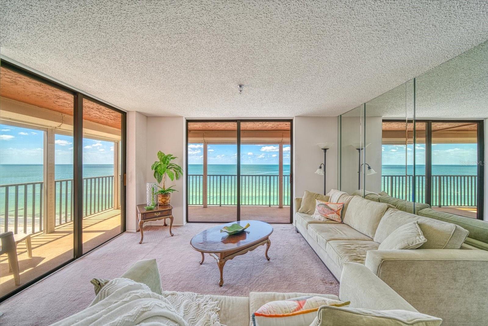 BEACHFRONT PARADISE is waiting with this DIRECT GULF FRONT Madeira Beach condo. This 3 bedroom, 2 bath unit has a spectacular floor plan with a large kitchen, gracious living area, an impressive 32 ft balcony, electronic storm shutters, and inside laundry. The primary bedroom features a large walk in closet and ensuite bath with dual sinks. Enjoy waking up to the sounds of the waves and watching dolphins play, and the boats pass from your bedroom! The large kitchen with breakfast bar has wonderful Gulf views where one can appreciate entertaining family and friends. Beachfront pool, hot tub, and BBQ area is there for you to enjoy the best of Florida living! This property is perfect for full time residence, vacation home or investment property. Madeira Towers is located in the heart of Madeira Beach within walking distance to restaurants, entertainment, shopping at Johns Pass, easy access to interstate. Plenty of guest parking!