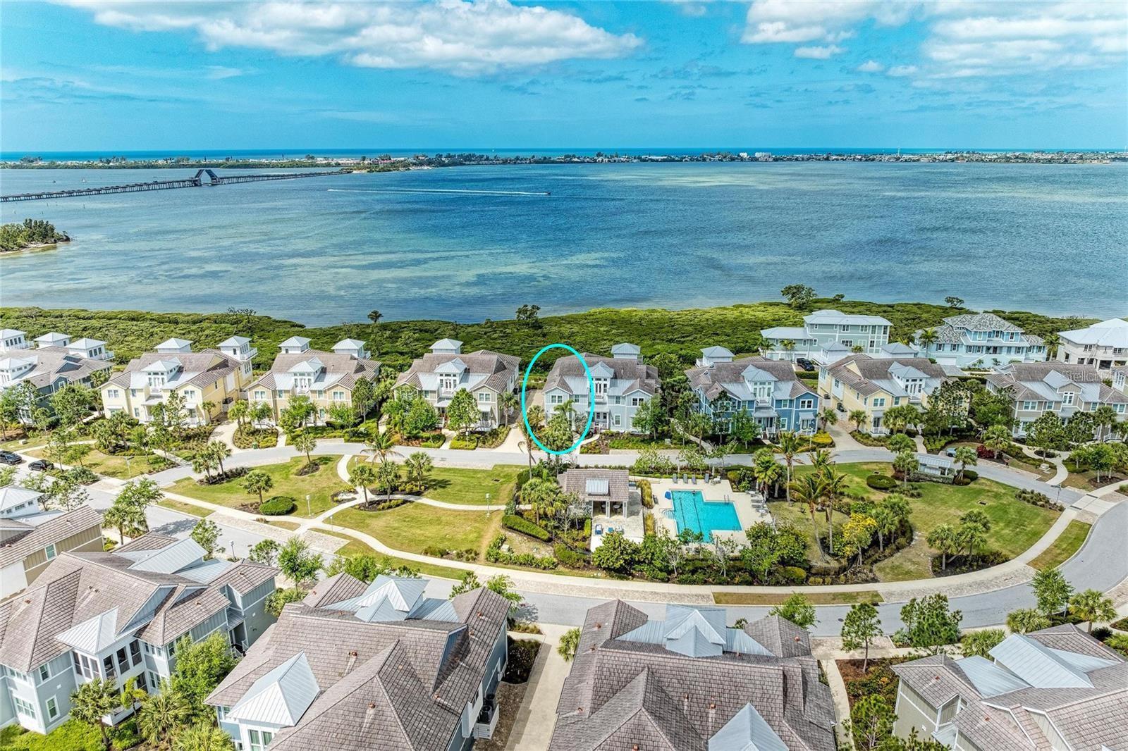 Virtually Staged. Spectacular, dazzling and breath-taking…are just a few words that could be used to describe the unbelievable views from this stunning home.  Welcome to your beautiful home with unparalleled water view of Anna Maria Sound and out into Tampa Bay in the luxurious, gated, much sought after, coastal resort community of Harbour Isle on Anna Maria Sound.  This light and bright Bermuda floor plan features 2002 square feet of gorgeous living space — including two bedrooms, two baths and an office/den (which can be easily converted into a third bedroom) located in the front of the home and in the rear, overlooking expansive water views, is the state of the art kitchen, dining area, living room and sunroom.  The expansive open living area features the kitchen (with upgraded cabinets, granite, stainless steel appliances with double oven and a custom walk-in pantry) and a large living and dining area custom made for entertaining.  Crown molding, tray ceiling in bedroom, upgraded lighting, custom window treatments, vaulted ceiling in living room, custom closet and wood and tile flooring are just a few of the upgraded feature in the home. The roomy Owner’s suite features walk-in closet, double vanities, linen cabinet, large shower and separate water closet.  Other important features in the home is an oversized two-car garage where you can access your private home elevator. While inside the gates at Harbour Isle, explore two miles of neighborhood walking trails and stroll to the nearby neighborhood pools with outdoor grills, cabanas, fire pit and kayak launch for the 38-acre lake.  End the day with an incredible sunset at the 23,000 square foot Beach Club overlooking Anna Maria Sound.  The Beach Club features resort-style amenities with the Sky Bar, Lounge, Pavilion, Fitness Center, Yoga Lawn, Event Lawn, resort pool, hot tub and a private beach to launch a kayak in the Sound.  Just outside the gates of Harbour Isle you’ll find the Margaritaville inspired Compass Hotel, Safe Harbour Marina with wet and dry storage and Floridays waterfront tiki restaurant.  Cross the Manatee Bridge and you’re on Anna Maria Island with its sugar sand beaches, over 30 restaurants and island charm.  It’s time to start living your best life.  Live, relax, enjoy an active lifestyle in award-winning Harbour Isle. Some photos are virtually staged.  The home comes with minimal furnishings.