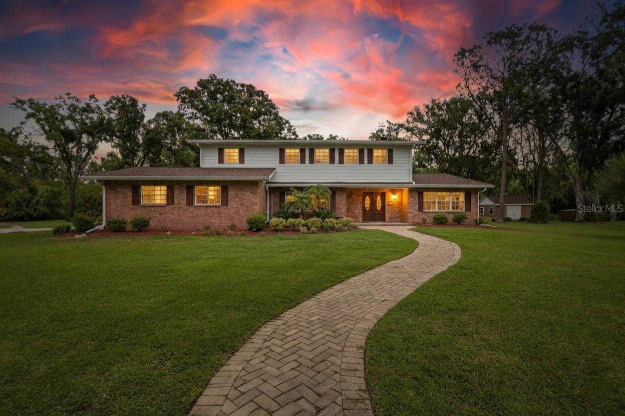 Priced at Appraisal. Discover a rare opportunity to own approximately 4.5 acres inside the city limits, complete with a private pond and charming bridge. This remodeled two-story home offers 5 bedrooms, 2.5 bathrooms, and modern updates throughout. The kitchen features granite countertops, while the spacious floor plan includes a gas fireplace, inside laundry with convenient chute, and an epoxy-finished two-car garage. Newer roofs and HVAC systems provide peace of mind. The detached guest suite is ideal for extended family or visitors, offering a full kitchen, bathroom, washer/dryer hook up, and its own one-car carport. Additional highlights include a storage shed, fully fenced property, and golf cart and trailer to convey with a full-price offer. Washer and dryer remain with the home with full price offer as well. This unique property combines country privacy with city convenience—complete with ample parking, fenced grounds, and multiple living options. Truly a must-see estate with character, function, and flexibility.