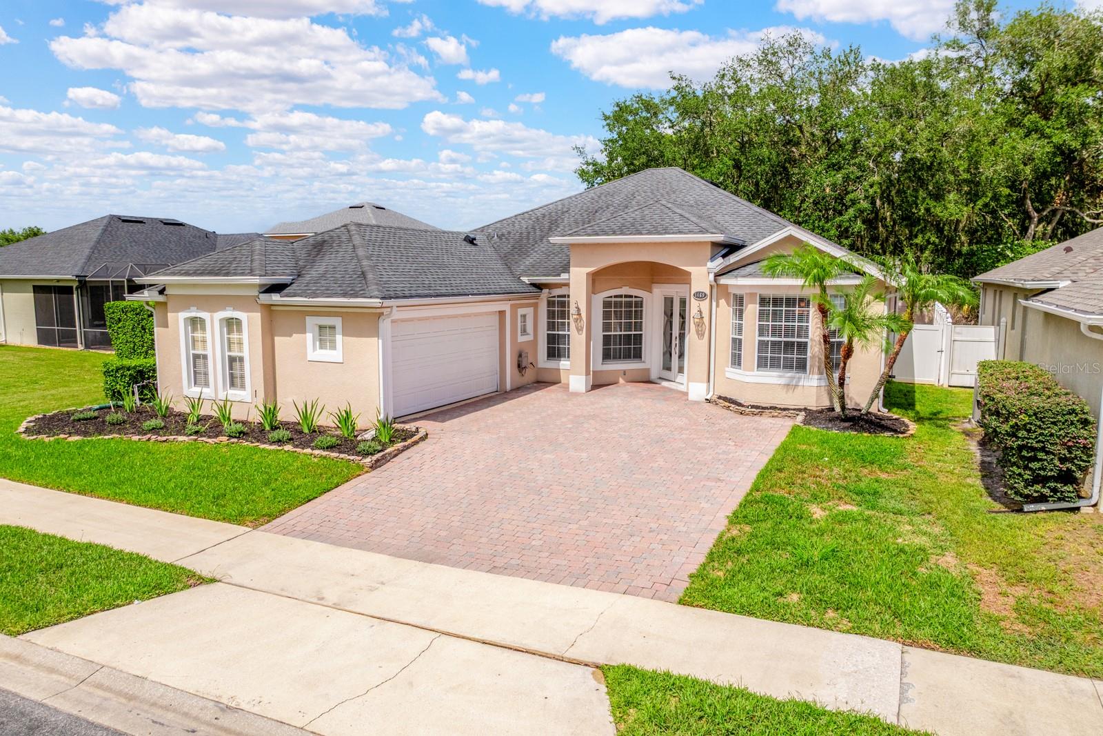Virtually Staged. Seller may consider buyer concessions if made in an offer  ~ Welcome to the GATED COMMUNITY ~ Retreat at Wekiva ~ where this beautifully maintained single-story POOL HOME delivers space, privacy, and the flexible floor plan you have been looking for! Recent updates include NEW CARPET in the guest bedrooms and a NEWER ROOF (2018), giving peace of mind while complementing the home's timeless style and exceptional care. The CUSTOM FRONT ENTRY DOOR creates a memorable first impression, opening to formal living and dining rooms designed for entertaining. Just off the foyer, a versatile FLEX SPACE provides endless possibilities as a home office, bonus room, playroom, or 4TH BEDROOM. Tile flooring flows throughout the main living areas, while the primary suite and flex room feature warm wood laminate flooring for added character and durability. At the heart of the home, the spacious kitchen overlooks a casual dining area and inviting family room, creating the ideal gathering space for everyday living and entertaining. A wall of sliding glass doors seamlessly connects the indoors to your private backyard retreat, where a COVERED LANAI, SUMMER KITCHEN, SCREENED POOL, above-ground SPA, and peaceful tree-lined backdrop create the ultimate outdoor oasis. With no immediate rear neighbors, you will enjoy added privacy while relaxing or hosting family and friends. The thoughtfully designed 3-WAY SPLIT FLOOR PLAN offers dedicated space for everyone. Your generous PRIMARY SUITE is tucked away at the back of the home with direct access to the lanai and pool, a well appointed en-suite bath, and an OVERSIZED CUSTOM WALK-IN CLOSET featuring an impressive built-in organization system. Bedroom two enjoys en-suite access to a full bath, while bedroom three is conveniently located next to a third full bath, making the layout ideal for guests or multi-generational living. Set on a spacious lot in one of Sanford's most desirable gated communities, Retreat at Wekiva is known for its quiet atmosphere, friendly neighbors, and holiday events throughout the year. Ideally located with quick access to I-4, SR 417, SR 429, US 17-92, shopping, dining, and everything Central Florida has to offer, this light-filled, MOVE-IN READY home delivers the perfect combination of versatility and Florida INDOOR/OUTDOOR LIVING. Call today to schedule a tour and fall in love with your new HOME SWEET HOME!