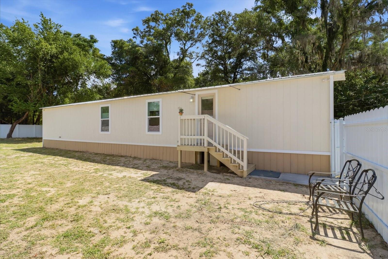 Welcome to Crystal River living at its finest! This fully renovated 2BD/1BA modular home offers 840 sq ft of move-in ready comfort, featuring a new roof, new A/C, white vinyl perimeter fencing, and impressive exterior lighting throughout the property. Step outside and enjoy everything nature’s coast has to offer — from world-class fishing at Kings Bay to swimming with manatees at the breathtaking Three Sisters Springs. A true escape from the city, yet within easy reach of Tampa (77 mi), Orlando (84 mi), and Gainesville (68 mi). Bring your boat, side by side, all of your toys! With no rental restrictions and an estimated rental income of $1,200/month, this property is as smart an investment as it is a beautiful place to call home. Perfect as a starter home, seasonal getaway, or income-producing rental!