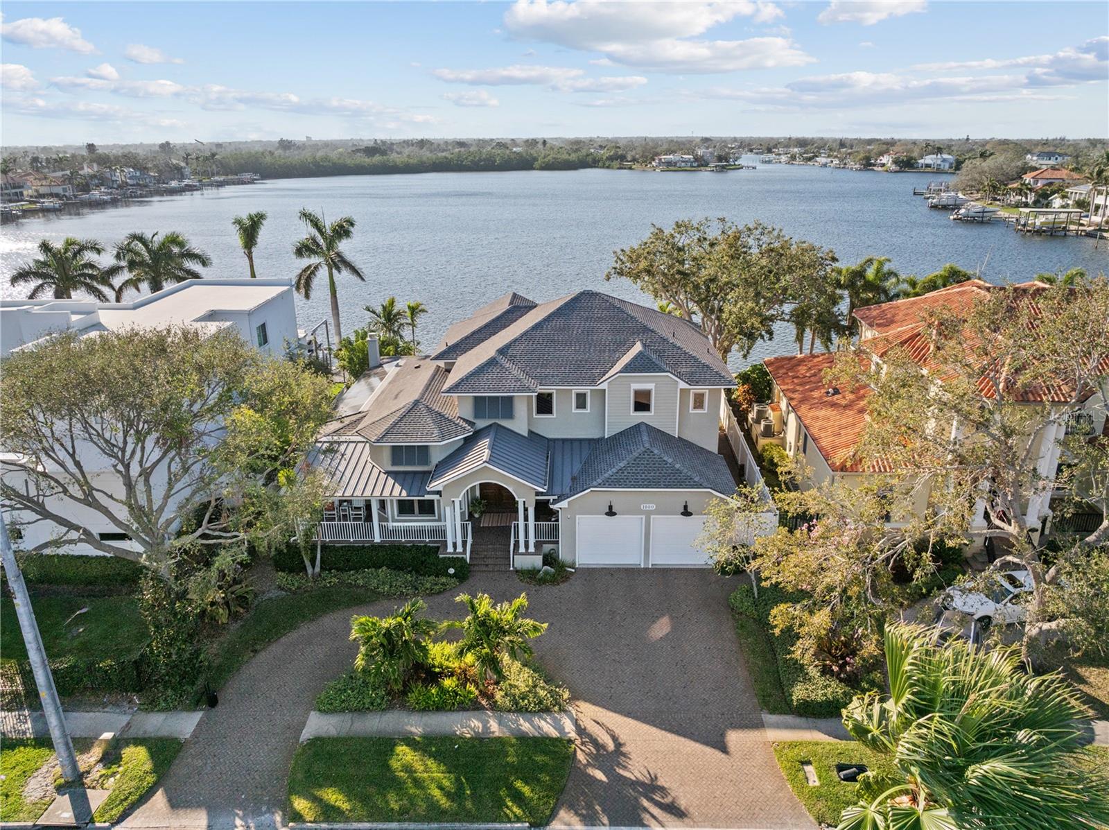 Located along the open water of Smacks Bayou, this custom-built waterfront home in Snell Isle offers comfort, convenience, and a boatload of fun for your Florida lifestyle. Designed with family and entertaining in mind, this 4-bedroom, 3.5-bathroom home showcases soaring ceilings, rich cherry hardwood floors, and hurricane-impact windows and doors, ensuring both beauty and peace of mind.
The first-floor primary suite opens to the covered back porch with a cozy fireplace, perfect for unwinding as the sun sets over the bayou. The heart of the home is the gourmet kitchen, where a Thermador six-burner gas range with double ovens, Sub-Zero refrigerator, walk-in pantry, prep sink, custom solid wood cabinetry, and quartz countertops create a space that is as functional as it is stunning. Views of the water can be captured from a wall of doors in the great room. The private home office is the ideal space to escape and get work done. 
Upstairs, the home offers ample space for relaxation and entertainment, featuring a spacious den that leads to an oversized covered terrace. Three additional bedrooms and two full bathrooms complete the second floor, providing privacy and comfort for family or guests. 
Outside, the resort-style backyard is designed for year-round enjoyment and the landscaping creates the privacy you desire. The outdoor kitchen, saltwater pool, and spa set the stage for unforgettable gatherings, while the composite dock (2018) with power, water, and two boat lifts (16,000 and 4,000 lbs) offers convenient access to Tampa Bay. Additional features include an oversized two-car garage extra room for storage, three AC units (2023 & 2024), GAF roofing (2020), two tankless water heaters, solar panels (2020 paid in full), and so much more. Everything on this home has been well-maintained and upgraded. 
Located just minutes from Downtown St. Petersburg, fine dining, museums, waterfront parks, and the Vinoy Golf Club, this exceptional home offers is perfect for someone seeking an active boating lifestyle on a quiet street in one of the area's most sought-after neighborhoods.