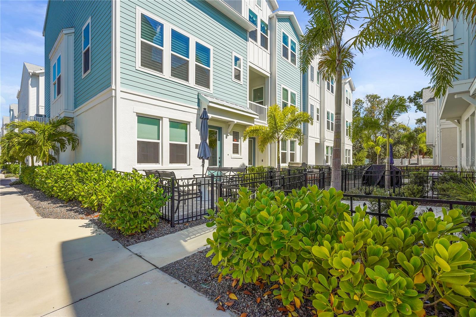 BEST DEAL in town!! Where modern sophistication meets the energy of downtown Sarasota, this exceptional three-story residence offers a lifestyle few homes can match. Designed with one of the community's most desirable layouts, the home features additional windows that flood the second floor with natural light, creating an atmosphere that feels bright, open, and effortlessly refined. Thoughtfully curated with designer finishes throughout, the home balances clean contemporary style with everyday comfort. At its heart, the chef's kitchen showcases sleek Quartz surfaces, premium appliances, abundant storage, and an oversized island that invites everything from casual mornings to elegant entertaining. The open-concept living spaces flow seamlessly to a private balcony, while a versatile first-floor suite with its own full bath offers the ideal space for guests, a home office, or a private retreat. Upstairs, the primary suite is a sanctuary of understated luxury, complete with a spa-inspired bath and expansive walk-in closet. Every detail has been carefully selected to create an atmosphere that is both sophisticated and welcoming. Completing the home is an oversized two-car garage featuring upgraded overhead storage on both sides serving as an exceptional convenience for organizing beach gear, bicycles, and seasonal essentials without sacrificing parking or living space. Beyond your front door, the Sarasota lifestyle truly comes to life. Just a short stroll away, Payne Park offers a lush urban oasis with scenic ponds, walking paths, tennis courts, and direct access to the Legacy Trail bringing nature, recreation, and wellness seamlessly into your everyday routine. Spend your afternoons exploring downtown's celebrated culinary and arts scene, then end the day with a sunset at Lido Key. Resort-style amenities including a sparkling pool, spa, cabana, and dog park complete this exceptional lifestyle. Rarely does a home combine exceptional design, abundant natural light, thoughtful functionality, and an unmatched downtown lifestyle so effortlessly and at such a low price! This is more than a residence, it's an invitation to experience Sarasota at its finest. Schedule your private showing TODAY before it’s gone !!
