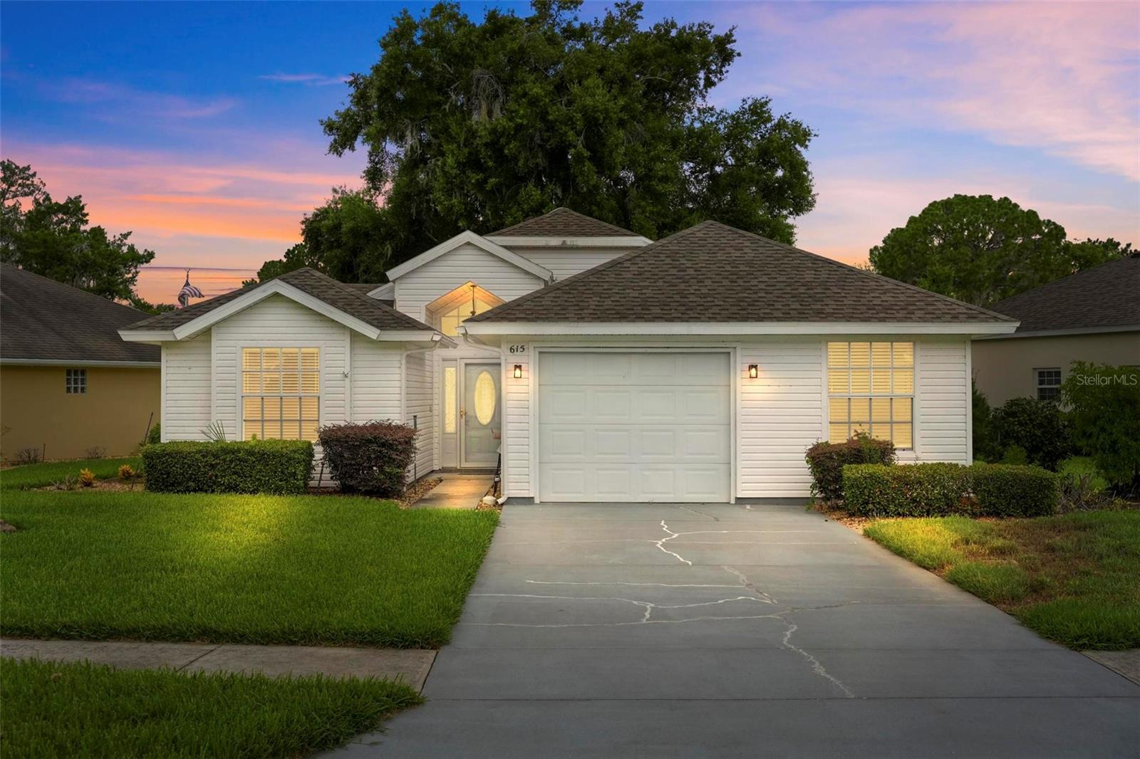 55+ COMMUNITY.  615 Juniper Way, a well-maintained home located in the newer Phase 3 of this 55+ golf community in Tavares. SOLAR PANELS installed in 2022 and Paid. NEW ROOF 9/2021, HVAC 2021, WATER HEATER 2021. Recent updates include granite countertops, luxury vinyl flooring and newer appliances.  The kitchen offers a comfortable space for cooking and casual dining. A third bedroom or flexible office space is conveniently located just off the kitchen, and the split floor plan provides added privacy and an easy flow for everyday living. The bright and airy enclosed lanai is an inviting place to relax while taking in the expansive golf course view, where the open fairway creates a peaceful Florida backdrop. HOA-maintained landscaping allows more time to enjoy the community’s swimming pool, fitness center, clubhouse, and meeting space for social activities. Located in the heart of Lake County, the home is just minutes from downtown Tavares, public boat ramps, Wooton Park, Lake Dora, and the Harris Chain of Lakes, with convenient access to boating, fishing, shopping, dining, The Villages, the Orlando area, and Florida’s Atlantic coast.