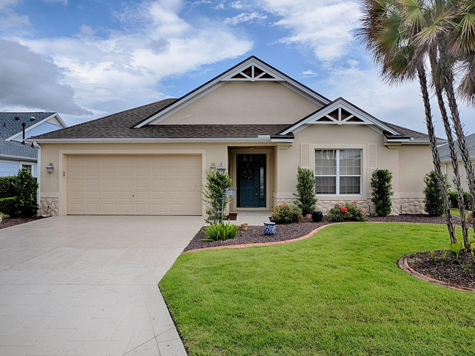 Exceptional Bridgeport Designer Home with Water Views in the Village of Caroline! Welcome to 1029 Vance Trail, a beautifully updated 3-bedroom, 2-bath Bridgeport model ideally positioned on a scenic waterfront homesite in one of The Villages’ most desirable locations. Just minutes from Lake Sumter Landing Market Square, this home offers the perfect blend of comfort, style, and convenience. From the moment you arrive, you’ll appreciate the pride of ownership and thoughtful updates throughout. Inside, the spacious open floor plan is filled with natural light and showcases beautiful stone countertops, generous living and dining spaces, and stunning views of the water beyond.
The well-appointed kitchen serves as the heart of the home, offering ample workspace and storage while seamlessly connecting to the main living areas—perfect for entertaining family and friends. The spacious primary suite provides a peaceful retreat, while two additional bedrooms offer flexibility for guests, hobbies, or a home office.One of the home’s standout features is the enclosed lanai, creating a year-round space to relax and enjoy the tranquil waterfront setting. Whether sipping your morning coffee or unwinding at the end of the day, you’ll love the peaceful views and Florida lifestyle this home provides. Recent improvements offer tremendous value and peace of mind, including a new roof in 2024, tankless water heater installed in 2020, gas furnace replaced in 2026, and a newly finished epoxy garage floor. The bond balance is only $7,093.Conveniently located near golf courses, recreation centers, shopping, dining, and nightly entertainment, this exceptional home places you in the heart of everything The Villages has to offer. Rarely does a waterfront Bridgeport model with these updates and this location become available. Come experience the view, the lifestyle, and the opportunity to make this beautiful home your own.