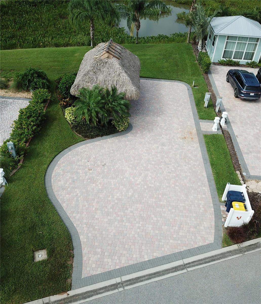 Attention Class A RV Owners - THE PERFECT RV RESORT AWAITS YOU! A large paved RV Pad with a huge 14 x 20 Tiki Hut in the gated 55 and over community of Bay Lake Motorcoach Resort. Ideal for full-time living, snowbird or investment/rental. It's an easy stroll to the resort's beautiful clubhouse which features a large pool, spa, exercise room, card/game room, banquet room, kitchen, craft and theater rooms. Your large lot can accommodate an excellent Casita if you want to build one in the future. The large Tiki hut is a great place to sit and relax, getting away from the Florida Sun. It's the perfect place to enjoy cookouts. This lot provides a great tropical view of palms and water in the pond with a view of lake Mattie, behind this private lot. This property is the perfect place to entertain all your friends. This broad paved driveway has ample room to park your Class A or Super C up to 45 ft. motorcoach. RV/Marine lighted pedestal has 50 Amp, 30 Amp, 15 Amp and water connection next to a sewer connection, Don't miss the resort's unique boat dock for private use with a boat launch which provides access into Lake Mattie! Park your MOTORCOACH and relax in luxury. Conveniently located between Tampa and Orlando, this RV Pad offers you great space and a short drive to all central Florida and coastal attractions (20 miles to Disney and all Orlando parks, short distance to nearby airports and surrounding cities), plus golf, restaurants and shopping.