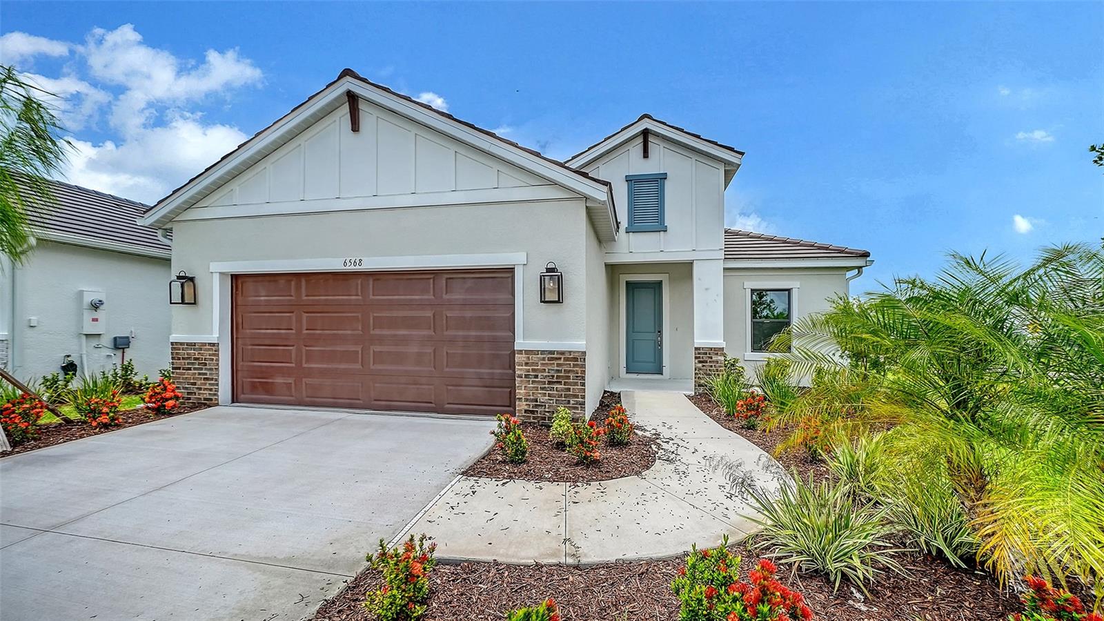 Competitively priced, this stunning White Star farmhouse-style home in Grand Park offers the perfect blend of comfort and design. The north-facing backyard keeps the home cool while providing sunshine on the lanai, which includes a gas hook-up for grilling. Tall privacy hedges line the paved walking trail just beyond the backyard, creating a peaceful, custom-landscaped feel. Enjoy quick, walking-distance access to the Grand Park clubhouse and community amenities directly from the trail.

Interior highlights include impact glass windows, 8-foot interior doors, a double-door den, walk-in pantry, recessed ceilings, wood cabinetry, quartz countertops, and wood-look tile flooring throughout.

This home combines high-quality finishes, energy efficiency, and a desirable location—all at a great value in Grand Park.