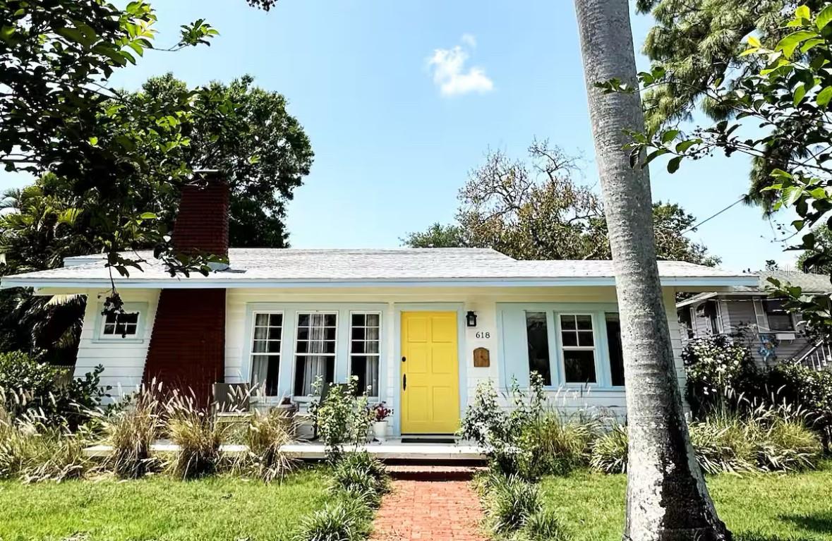 Absolutely stunning 1925 home in Historic Bradenton with Guest House/Efficiency located steps from Downtown, walking distance to shopping,
dining, Manatee River & public transportation, and only 15 minutes from gorgeous Gulf beaches, including famous Ana Maria Island! Outstanding
location with several lucrative short-term rentals here. Located in an Opportunity Zone for added tax savings and investment potential. Stroll up
the red brick path to the quaint front porch of this lovingly restored and updated home. Upon entering the front door, you'll immediately notice
the restored wood plank flooring in the large great room with cozy fireplace and loads of natural light! The ceilings were raised adding to the
roomy feel of this open, well-thought out floorplan. To your right, the third bedroom features French doors and looks out over the front of the
home, making a great work-from-home-office. Beyond the great room is the formal dining room and beyond that, the renovated kitchen with
solid wood cabinets, 2019 SS appliances, including 5 burner gas stove and spotless butcher block counters. Beyond the kitchen, is the laundry
room, complete with washer & dryer that doubles as a mud room and leads to the back door. The hall bathroom features a gorgeous claw-foot
tub with shower head and linen closet. The bedrooms are designed in a 3-way split with the office/bedroom in the front, the second bedroom in
the middle of the home, off of the dining room and the primary bedroom in the back of the house. The primary bedroom boasts an en suite
bathroom with stand-up shower and two walk in closets. Walk in closet in the second bedroom, as well. Detached garage in back has been
converted to an efficiency with kitchenette, full bathroom with stand-up shower and walk-in closet, adding an additional sq ft of living space So
many great possibilities for this space - in-law suite, young adult apartment, potential income-producing. However, there is still a garage door and
opener, so you could convert back if that's your preference. Adjacent driveway has plenty of room to park two large vehicles, a bit more space
toward the alley to park one more, and the other side of the garage has ample room for boat or RV parking. The side yard is fully fenced for your
furry friends, and the deck is roomy enough for grilling, lounging and entertaining. Recent upgrades include newer kitchen and bathrooms,
restored windows, updated plumbing & electric, updated electrical panel, new roof, A/C and ductwork (2018), sprinkler system (2021), new
driveway (2021), guest house remodel (2020).