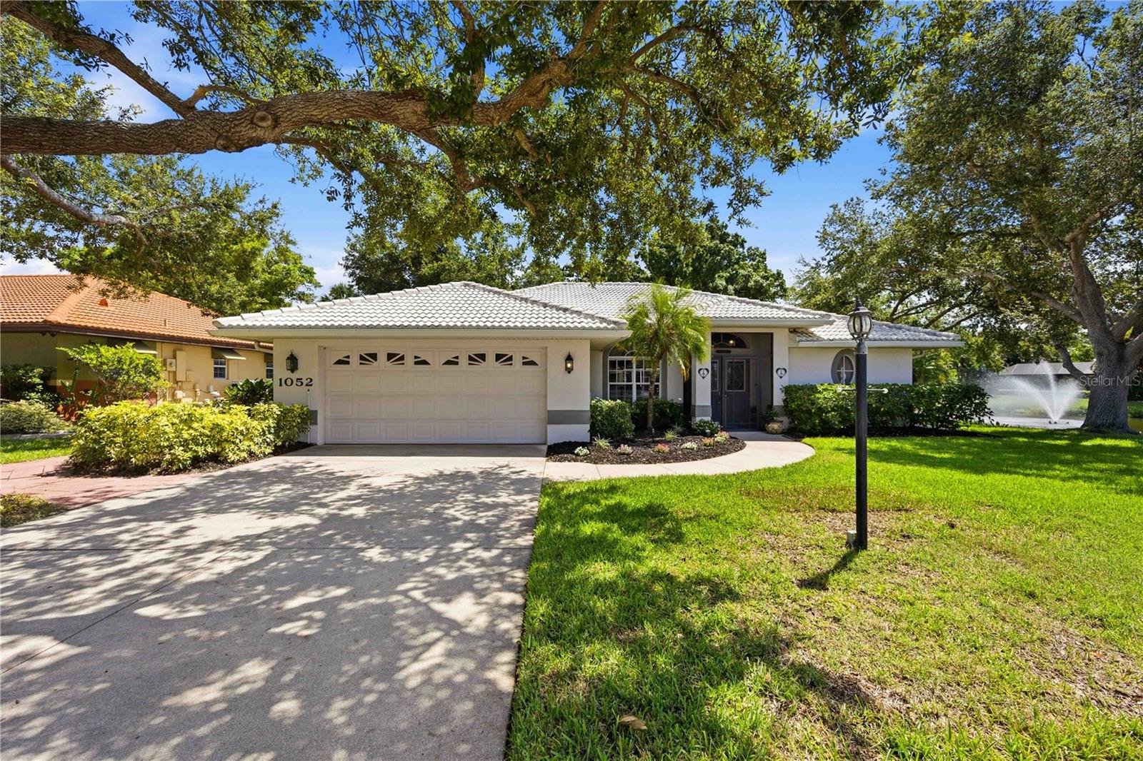Light bright completely updated and move-in ready this exceptional three bedroom two bath home with a two car garage is located in the highly sought after Laurel Woodland’s community. Featuring soaring Cathedral ceilings, abundant, natural light and tranquil water views this home offers the perfect blend of comfort and elegance, arriving through the front screened entry, you are welcomed with double decorative lead and etch glass doors, accessed by a dramatic arched transom window. The sun filled foyer creates a warm and inviting first impression while maintaining privacy. The cheerful breakfast nook is surrounded by oversized windows that fill the space with gentle morning light and provide peaceful views of the lanai and pool area. It’s the perfect spot to enjoy morning, coffee, casual meals, or gatherings with family and friends the beautifully renovated kitchen completed in 2021 features  custom cabinetry with pull out shelves, granite countertops under cabinet lighting, soft close drawers, a double pantry and brand new refrigerator and range. 
Additional updates include a new AC system in 2025 new pool pump and pool heater in 2025 and tastefully remodeled (2021) bathrooms showcasing custom tile work, custom cabinetry, granite countertops, industrial style hardware and new tile showers. 
Step outside to your private screened lanai overlooking a serene pond with picturesque fountain views.  The heated saltwater pool creates a resort style setting for swimming, entertaining or simply relaxing. A covered seating area allows for year round enjoyment of Florida’s coveted, indoor outdoor lifestyle. Additional highlights include low HOA's fees and no CDD's fees making this home as practical as it is beautiful don’t miss this opportunity to own a meticulously updated waterfront retreat in one of the areas most desirable communities. Just a few things we love about this location, close to beaches, shopping and down town Venice, Legacy trail just a few min down the street.