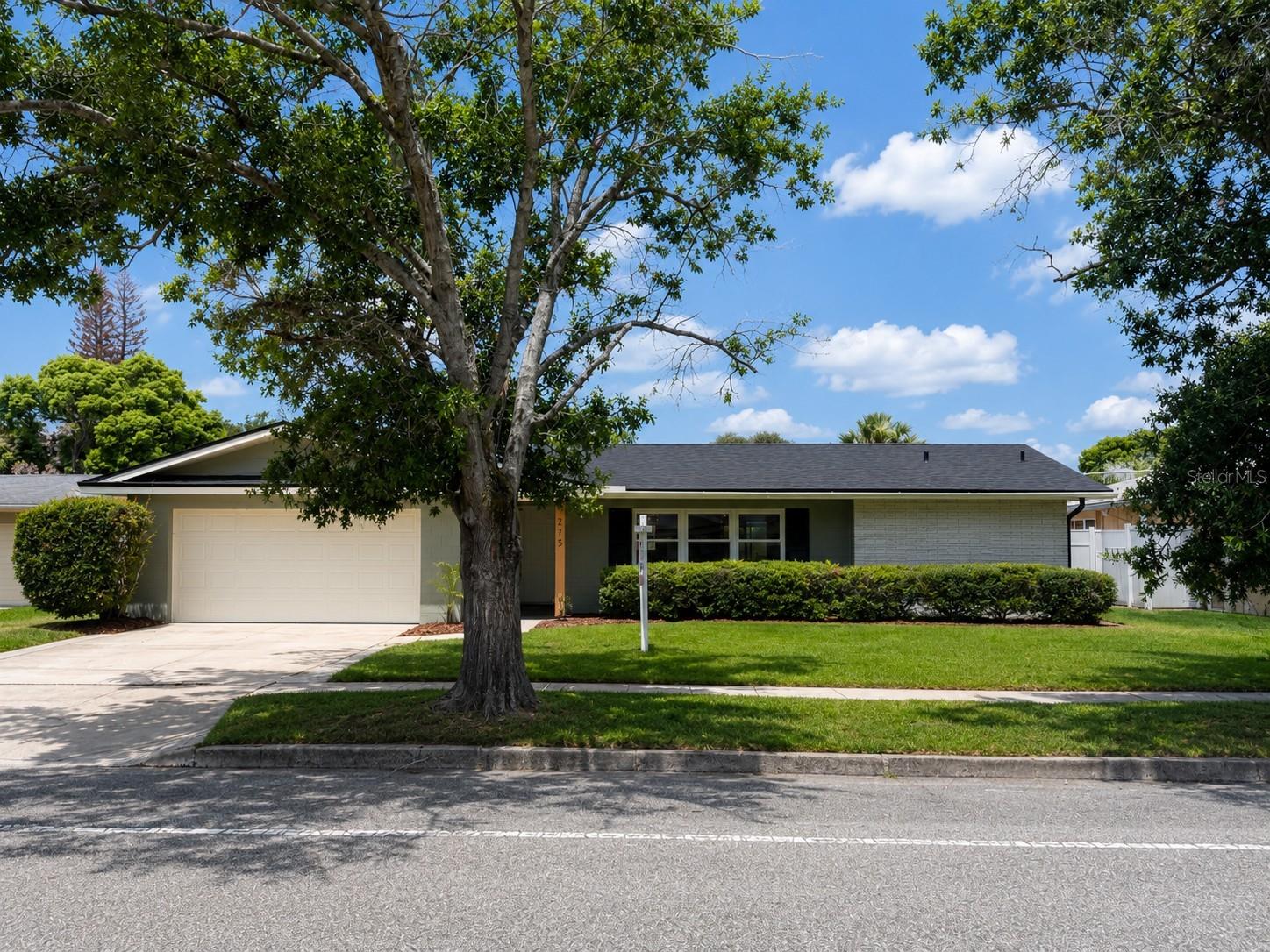 Completely reimagined and professionally renovated, this stunning Winter Park POOL home offers approximately 1,950 square feet of thoughtfully designed living space with a rare 4-bedroom, 3-full bathroom floor plan, a 2-car garage, and an exceptional blend of style, function, and quality craftsmanship. At the heart of the home is a show-stopping open-concept kitchen featuring custom shaker cabinetry, quartz countertops, a dramatic oversized center island, designer lighting, a custom range hood, and a striking tile feature wall that creates a true focal point for the home. Warm wood accents, curated finishes, and seamless flow into the living and dining spaces make this home ideal for both everyday living and entertaining. The split-bedroom floor plan provides privacy and flexibility, with the primary suite situated on one side of the home and the secondary bedrooms located on the opposite side. All three bathrooms have been completely gutted and beautifully remodeled with high-end finishes and timeless design selections. Luxury vinyl plank flooring extends throughout the home, creating a cohesive and modern aesthetic. Major improvements include a NEW roof (2026), NEW AC system, NEW windows, NEW electrical, NEW water heater, RESURFACED POOL, updated lighting throughout, inside laundry room, and extensive interior renovations that allow buyers to enjoy the benefits of a truly move-in-ready home. Situated in the highly desirable Winter Park Pines area, residents enjoy convenient access to Park Avenue, Downtown Winter Park, Cady Way Trail, Rollins College, Full Sail University, UCF, shopping, dining, major roadways, and Orlando International Airport. Combining designer finishes, an open modern layout, a private pool, and an unbeatable location, this is a rare opportunity to own a fully renovated home in one of Central Florida's most sought-after communities. Schedule your private showing today.