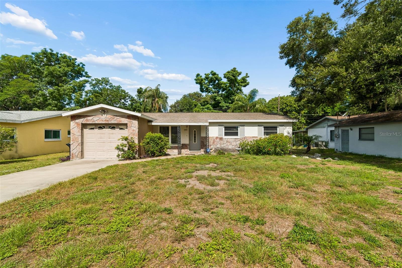 Virtually Staged. Welcome home to this move-in ready 3-bedroom, 1.5-bath residence in the heart of beautiful Clearwater, Florida! This charming home features a spacious kitchen with an abundance of cabinet space, a convenient breakfast bar, and an open flow into the dining area, making it perfect for everyday living and entertaining. The dining room overlooks both the kitchen and the large enclosed lanai, providing additional space to relax and enjoy Florida living year-round. All three bedrooms are generously sized, with the primary bedroom offering the convenience of an attached half bath. The updated hall bathroom adds modern appeal, and two of the bedrooms feature brand-new carpeting. Step outside to enjoy the private backyard, where you'll appreciate having no rear neighbors directly behind you and a lovely gazebo that creates the perfect setting for morning coffee, outdoor dining, or evening relaxation. The location is hard to beat—just minutes from shopping, dining, entertainment, and the world-famous Clearwater Beach. Whether you're looking for a primary residence, seasonal retreat, or investment opportunity, this home offers comfort, convenience, and an unbeatable Florida lifestyle.