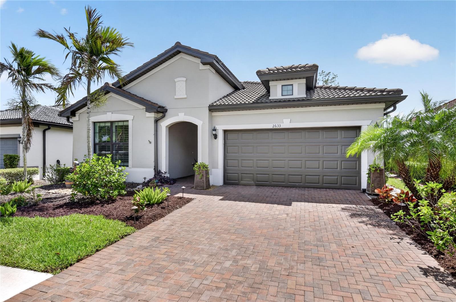 TAKE ANOTHER LOOK. FRESHLY PAINTED ENTRY AND LIVING SPACES!!  Welcome to 2633 Daisy Drive, located on a peaceful street within the highly sought-after Cypress Falls at the Woodlands, an exceptional 55+ gated community known for its vibrant lifestyle and resort-style amenities.

This beautifully designed 1,810-square-foot villa offers the perfect blend of elegance, comfort, and functionality. The home features two spacious bedrooms, two full bathrooms, and a versatile flex room—ideal for a home office, hobby space, or additional guest area.

As you step inside, you’ll immediately appreciate the open-concept design that seamlessly connects the living room, dining area, and kitchen—creating an inviting space perfect for both everyday living and entertaining. Tile flooring throughout and 8-foot interior doors enhance the sense of openness and sophistication, while natural light fills the home.

The kitchen flows effortlessly into an optional sunroom, creating a bright and relaxing space to gather with family and friends. Step outside to the partially covered lanai, the perfect place to enjoy your morning coffee or unwind with a good book while taking in the peaceful surroundings. Just beyond, your private pool offers a refreshing retreat—ideal for relaxing afternoons or entertaining guests in true Florida style.

Beyond the home, residents of Cypress Falls at the Woodlands enjoy an impressive collection of resort-style amenities, including a grand clubhouse, resort pool, resistance pool, hot tub, state-of-the-art fitness center, pickleball courts, tennis courts, bocce ball, horseshoes, and billiards. A full-time activities director and on-site management ensure a lively calendar of clubs, events, and social gatherings year-round.

Conveniently located near shopping, dining, golf courses, and the beautiful Gulf Coast beaches, this home offers the perfect combination of luxury, comfort, and the active Florida lifestyle.
Come experience everything this exceptional home and community have to enjoy.