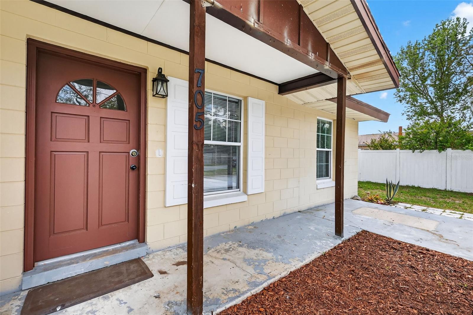 WELCOME to this 3 bedroom, 2 bathroom home in the tucked-away Park Acres neighborhood of Fruitland Park. Stop looking for someone else’s "finished" and start creating your own. This diamond in the rough is ideal for buyers that like doing projects of love. Step into an open floor plan with plenty of afternoon sun, where practicality meets convenience with an INSIDE LAUNDRY/UTILITY/MUD ROOM that leads to your private backyard with COMPLETE PERIMETER FENCING! What’s YOUR VISION? 705 Mike Avenue has been waiting for someone to love it.  BIG-TICKET ITEMS ALREADY DONE: NEW AC in 2022. NEW FLOORING in 2023. RENOVATED BATHROOMS in 2023. KITCHEN UPDATES in 2023. THE “FUN” STUFF IS UP TO YOU! Add instant equity with your DIY project skills. PRIME LOCATION & VALUE: This home offers the peace of a secluded community while remaining minutes from nearby parks, schools, shopping, the library, public transportation, and local favorite Mystic Ice Cream. Enjoy easy access to the best of Fruitland Park, Leesburg, and Lady Lake, with Brownwood’s Paddock Square only 8 miles west. 705 Mike Ave is ready for its next chapter—are you?