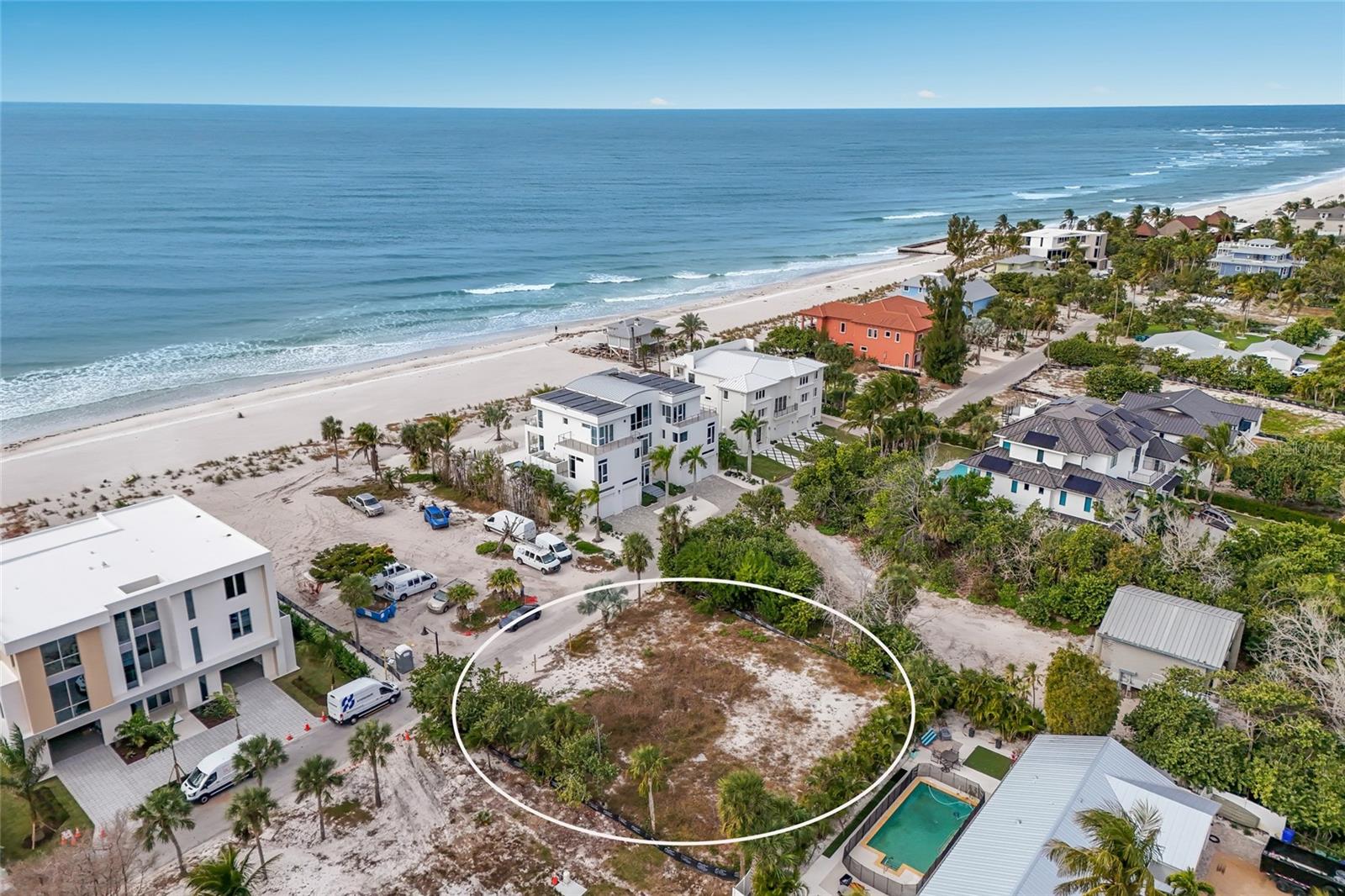 6500 Gulfside Road in Longboat Key...A Rare Opportunity to Build Steps from the Beach. Welcome to an exceptional chance to create your own coastal sanctuary on one of Longboat Key’s most treasured streets. Situated just steps from the powder-soft sands and turquoise waters of the Gulf of Mexico, this vacant parcel at 6500 Gulfside Road offers over 10,500 square feet of prime, buildable land—an expansive canvas for your dream beach residence. Perfectly positioned on the serene and coveted north end of the island, this homesite places you directly across the street from deeded beach access, allowing you to enjoy daily sunrise strolls, sunset vistas, and the restorative rhythm of the waves within moments of your doorstep. Whether envisioning a contemporary coastal masterpiece, a refined modern retreat, or a timeless island-style estate, this generous lot provides the space, flexibility, and setting to bring your architectural vision to life. Surrounded by mature tropical landscaping and tucked into a quiet residential pocket, the property offers an exceptional sense of privacy while remaining close to the best of Longboat Key living. A short walk or quick bike ride leads you to the charming shops and waterfront dining of the north end, including Mar Vista and Shore. Nearby, you’ll also find the natural beauty of Joan M. Durante Park, world-class boating and kayaking opportunities, and the gentle, unspoiled beaches that make this stretch of the island so beloved. With no home to remove, no renovation required, and immediate readiness for your builder, this parcel stands out as a true turnkey opportunity for those seeking to streamline the process of creating a custom coastal estate. Public utilities are available, and the generous dimensions of the lot provide ideal placement options for a pool, elevated living areas, lush landscaping, and outdoor entertaining spaces designed to capture Gulf breezes. Longboat Key continues to be celebrated for its low density, remarkable natural beauty, and refined lifestyle—offering the perfect blend of tranquility, sophistication, and recreation. Downtown Sarasota, St. Armands Circle, Anna Maria Island, and world-class cultural venues are all easily accessible, yet the property remains wonderfully peaceful, making it an exceptional location for a primary residence, seasonal getaway, or investment opportunity.If you’ve been searching for the ideal homesite to build a coastal haven that reflects your personal style and captures the magic of life near the Gulf, 6500 Gulfside Road presents a rare and rewarding opportunity. With its oversized footprint, unparalleled proximity to the beach, and charming north-end setting, this property invites you to create a life defined by sunlit mornings, barefoot afternoons, and unforgettable sunsets—just across the street from one of Florida’s most breathtaking shorelines.
Your piece of paradise awaits.