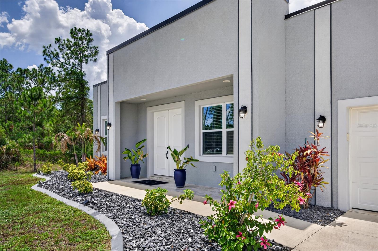 Welcome to your Florida dream home! This exceptional 3-bedroom, 2.5-bath canal-front residence combines modern design, durability, and everyday luxury in one stunning package. Built with solid concrete block walls and a sleek metal roof designed without overhangs for optimal wind protection, this home was thoughtfully constructed with safety and resilience in mind. Fully equipped with impact-rated windows, exterior and sliding glass doors, and a reinforced impact garage door, it offers both peace of mind and energy efficiency year-round.

Inside, you’ll find soaring 10-foot ceilings, upgraded 8-foot interior doors, and an open-concept layout that creates a bright and spacious feel throughout the home. The beautifully designed kitchen serves as the heart of the home, featuring quartz countertops, abundant cabinetry, and an open flow perfect for entertaining or everyday living. Natural light pours into the living spaces while tranquil canal views provide the perfect backdrop.

Additional highlights include a dedicated safe room, a fully fenced yard, and a peaceful waterfront setting ideal for relaxing outdoors. Conveniently located and close to Downtown Wellen, shopping, dining, entertainment, and CoolToday Park — the spring training home of the Atlanta Braves — this home offers the perfect blend of modern coastal living and prime location. Some images have been edited using Ai.