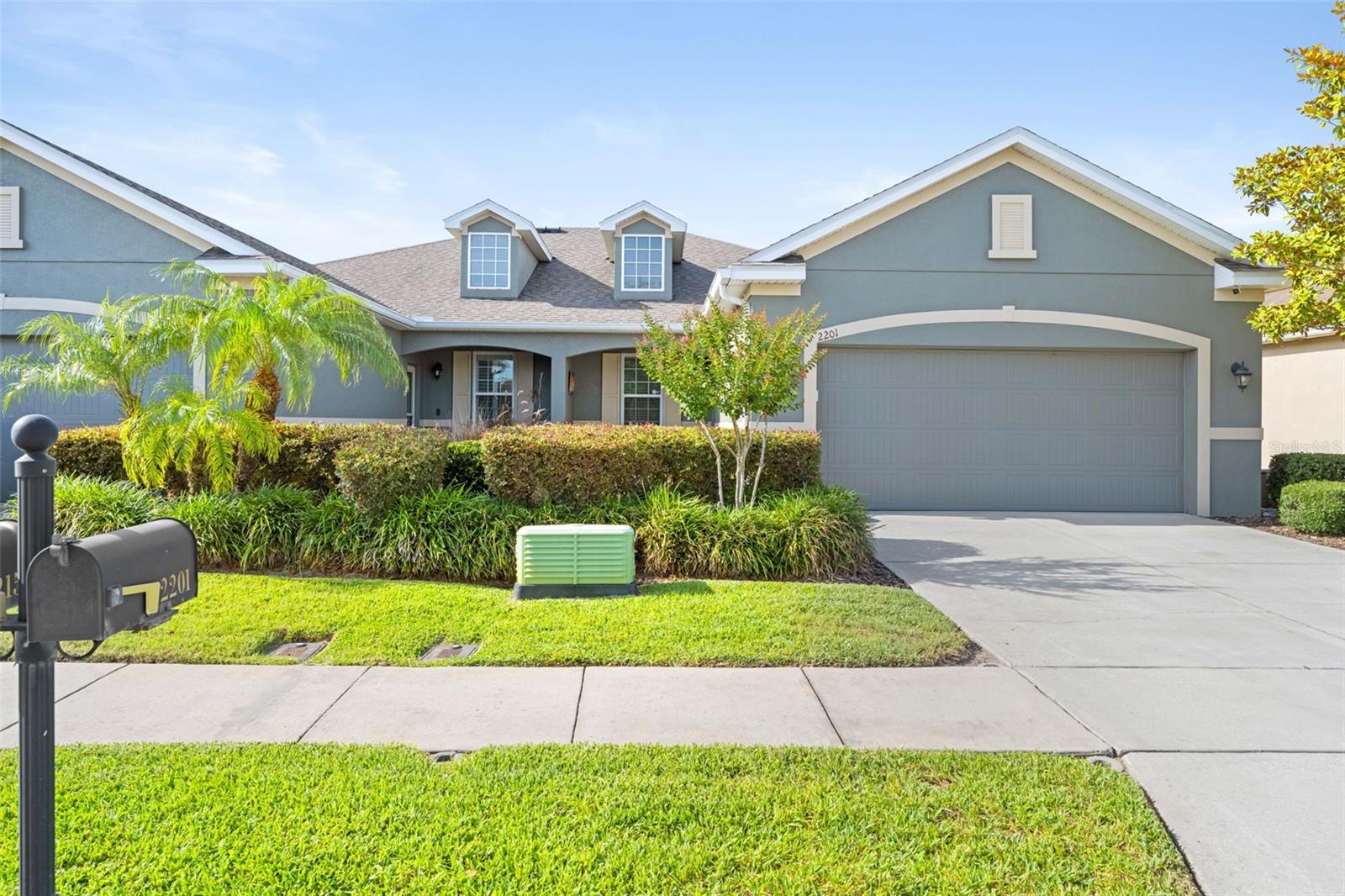2201 Parrot Fish Drive, Holiday, FL Gulfwinds Villa | 3 Bed + Den/Office | 2 Bath | 2-Car Garage | 1,876 Sq Ft | Maintenance-Free Living | NOT in a flood zone Built in 2013, this beautifully designed one-story villa lives like a single-family home - without single-family maintenance headaches. Tucked away on a private cul-de-sac, this 1,876-square-foot home features soaring ceilings and an open-concept kitchen, dining, and family room that creates an airy, spacious feel. The oversized granite island is perfect for entertaining, while the kitchen also features 42-inch wood cabinets with pull-out shelves, stainless steel appliances, an undermount sink, a closet pantry, and large neutral ceramic tile throughout. Every space is designed to be both functional and stylish. The private primary suite is thoughtfully designed with a large walk-in closet and a spa-like en suite bathroom featuring dual granite vanities, an oval soaking tub, walk-in shower, and private water closet. Bedrooms two and three are located on the opposite side of the home with a second full bathroom, offering ideal separation for guests, family, or hobbies. The den, complete with French doors, provides flexible space perfect for a dedicated home office or additional sitting area. An interior laundry room with full-size appliances, utility sink, cabinetry, and extra storage adds even more convenience. Step outside to the screened lanai with double doors and enjoy true indoor-outdoor Florida living. With no rear neighbors, privacy landscaping, and ample space to relax, the backyard feels like a private retreat. The lanai is also hot tub-ready with a dedicated 240-volt hookup. The fully fenced yard includes beautiful landscaping on a programable irrigation system, a stone paver patio, raised garden bed, and dedicated grilling area. Additional features include a spacious 2-car garage with built-in workbench, attic storage with ladder access, and plenty of room for organization. A whole-home water softener system enhances daily comfort while adding to the home's thoughtful upgrades and functionality Low HOA fees cover lawn service, internet, cable, exterior maintenance, roof replacement, and more. The community pool is just around the corner, making year-round relaxation effortless. This truly is maintenance-free living at its best. Gulfwinds is ideally located close to schools, marinas, fishing piers, shopping, golf, dog parks, splash parks, and the natural beauty of Florida's Gulf Coast. Nearby attractions include Anclote River Park, Anclote Gulf Park, and Tarpon Springs Sponge Docks with its famous Greek restaurants, shops, and cultural events. A new walking and biking trail system conveniently connects the community to nearby parks and the Pinellas Trail. Private cul-de-sac location. Smart floor plan. Low maintenance. Exceptional location.