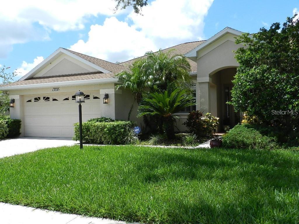 RENOVATED 4 Bedrooms, 3 bathrooms , Den, family room, living room, dining room, 2 car garage, heated pool with Spa and fountain. Completely repainted inside. A charming brick hallway leads to front French doors, leading to bright dining and living room with expansive view through triple sliding doors of pool, lanai and lake. High ceilings, custom lighting, crown molding, tray ceilings,New window treatments and planters shutters. Attractive large Family room with built in entertainment center, pre-wired, adjoining the open kitchen and eat in kitchen. The kitchen features custom designed maple cabinetry, roll out shelving, Corian counter tops and upgraded appliances, gaz range. One guest room has an en suite bathroom leading directly to the pool. The social areas have 18"x18" diagonal tile flooring. The enlarged, screened 14'x28' heated pool and spa has a decorative fountain, pour over and the required pool barrier fencing. The expanded pool deck area has a plumbed gas outlet for a future outdoor grill. Additional features include a newer hot water heater and heat pump for cooling and heating, built-in pest control system, wiring for home security. Located in popular LWR, great schools, convenient to shopping, dining and medical.