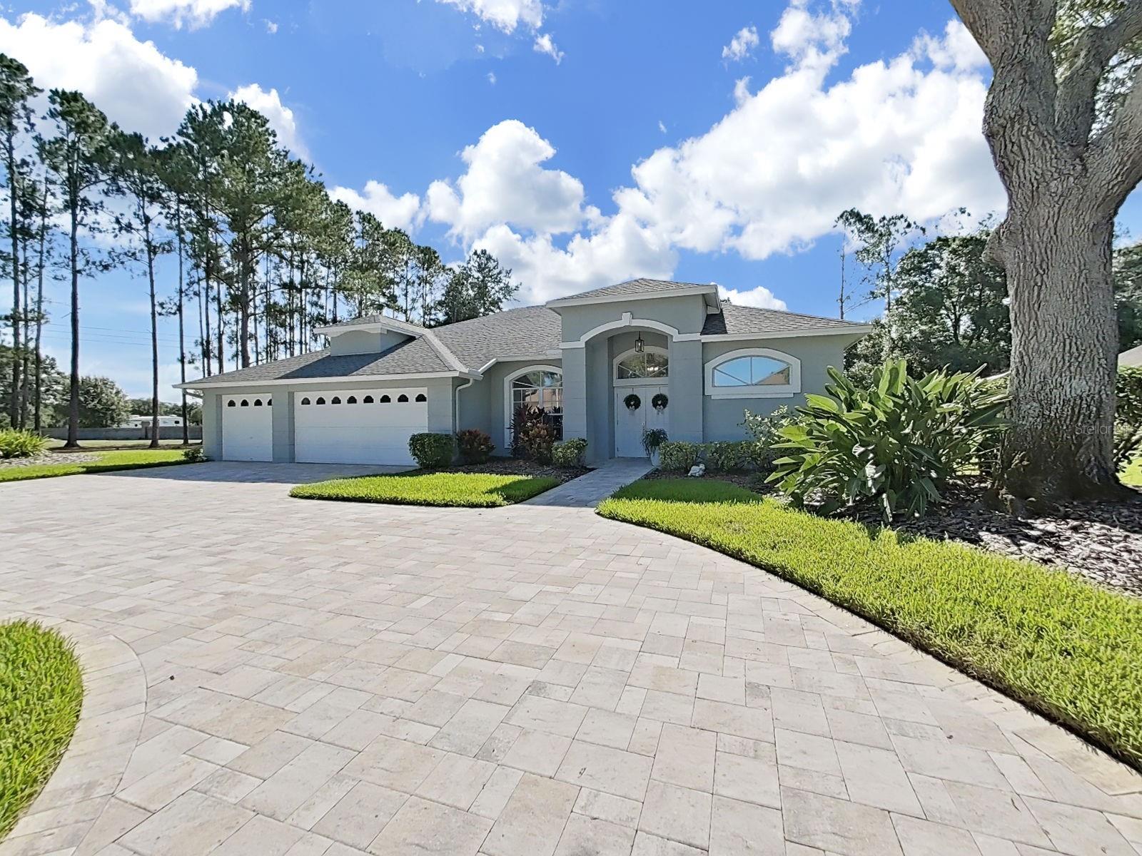 Virtually Staged. Luxury pool home in prestigious Van Dyke Farms is ready for a new owner. As you approach the home on a quiet dead end street, you will notice the pavered circular driveway leading to double door entry and the sunburst windows. Upon entering the home you will have an inviting view of the pool through the formal living room. Entertain in style with this open floor plan and its formal dining room. The home features a three way split floor plan with the master suite on one side secluded from the other living areas providing privacy yet access to the pool area through French sliding patio doors. The boutique walk in closet features modular options and a professional custom design. There is also an additional built in closet for extra space. The en-suite bath has a tub with separate shower and dual vanities with lots of counter space. In the central part of the home is the large kitchen with a breakfast nook with sliders that lead to the pool. Natural light from the skylight in the breakfast area makes this area bright and inviting. The kitchen overlooks the family room with wood burning fireplace and three pocket sliders leading to the pool. The kitchen area features recessed lighting, pendant lighting, soft close cabinets, stainless steel applicanes, tile backsplash, granite counters and plant shelves or display space. The refrigerator has two ice makers...drawer access and in the front access. Both the dishwasher and refrigerator were purchased in 2026. There are two bedrooms that share the hall bath off the family room. The fourth bedroom is at the end of family room area and features its own bath, which also serveds as a pool bath. This makes an excellent in-law suite or guest suite. The laundry room features a large utility sink, closet and washer and dryer. The three car garage has storage cabinets and a workbench. There is a plumbed area for putting in an outdoor shower by pool area. Other benefits to owning this home are knowing that the Trane HVAC was replaced in 2024 and it features an Ecobee smart thermostat system; 80 gallon hot water heater 2024; entire home repiped in 2024; and a HALO self-contained whole house water system was installed in 2024; garage door opener 2026; sprinkler box control panel 2026. The Van Dyke Farms community includes tennis, basketball and pickle ball courts, lots of open areas for evening strolls and a playground. The community is close to shopping, restaurants, schools, as well as quick access to the Veterans/Suncoast Parkway. You will love the feeling of living in the country with the amenities of city living only minutes away.