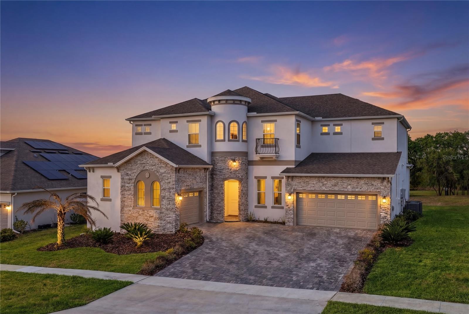 THE BEST OF AVALON RIDGE. FULLY UPGRADED. DESIGNER-CURATED. UNMATCHED.
Welcome to one of the most exceptional residences in Avalon Ridge, a 2024-built estate that sets the standard for luxury living. Offered at $2,000,000, this is not just another home in the neighborhood, it is the benchmark: the most upgraded, most refined, and most thoughtfully designed.
Spanning a grand two-story layout, this residence offers 6 bedrooms, 5 full baths, and 2 half baths, seamlessly blending modern sophistication with elevated functionality. From the moment you enter, you’re met with striking architectural presence, enhanced by custom high-end carpentry, bespoke built-ins, designer vanities, and fully customized walk-in closets; every inch curated with intention.
The home is grounded by premium upgraded flooring throughout and anchored by a true gourmet kitchen, a showpiece space designed for both everyday living and elevated entertaining. Flowing effortlessly into expansive open-concept living areas, this home was built to impress and perform.
The main-level primary suite is a private sanctuary, featuring a spa-inspired bath, dual vanities, and an oversized custom closet. Floor-to-ceiling sliding glass doors flood the home with natural light and open to a generous backyard, complete with approved plans for a future resort-style pool, offering the opportunity to create a true private oasis.
Upstairs, the lifestyle continues with a spacious loft featuring a built-in wet bar, perfect for entertaining or unwinding. Four additional bedrooms include a well-designed Jack-and-Jill layout, while a dedicated bonus/media room provides flexibility for a theater, game room, or lounge.
ADDITIONAL HIGHLIGHTS INCLUDE: 
Dual laundry rooms (both levels for ultimate convenience) *
Two EV charging stations *
Designer lighting and custom window treatments throughout *
Extensive built-ins and upgraded finishes that convey.
For those seeking a fully turnkey experience, select designer furnishings may be available, making this one of the most compelling move-in-ready opportunities in Winter Garden.
This is more than a home, it’s the crown jewel of Avalon Ridge. A rare opportunity to own the best-renovated, best-designed, and best-presented property in the community.