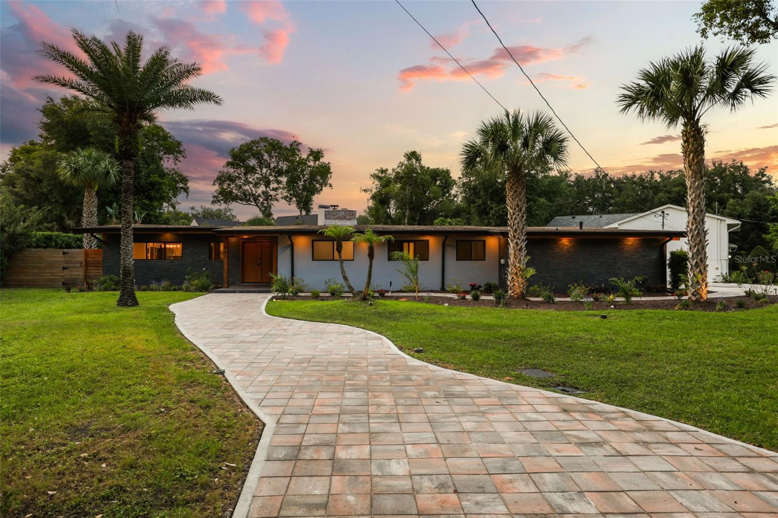 Tucked between the shores of Lake Nina and Lake Maitland, this beautifully reimagined California ranch blends modern design with effortless everyday living in one of Maitland’s most desirable locations. Completely remodeled in 2022, the home showcases a fresh, sophisticated aesthetic with thoughtfully curated finishes throughout.

The light-filled interior offers seamless flow between living spaces, combining clean modern lines with warm, inviting character. The renovated kitchen features a brand-new range, oven, and microwave, creating a stylish and functional centerpiece for both entertaining and daily life. Custom closets throughout the home provide elevated organization and exceptional storage.

In addition to the main living areas, a spacious bonus room offers incredible flexibility and can easily function as a second family room, home office, fitness studio, playroom, or media space to fit your lifestyle needs.

Step outside to a private backyard retreat designed for entertaining, complete with a sparkling pool, expansive outdoor living space, and plenty of room for gatherings, dining, and relaxing under the Florida sunshine. The indoor-outdoor flow perfectly captures the essence of California-inspired living.

Ideally positioned in a picturesque pocket of Maitland between two beautiful lakes, this home also benefits from zoning for top-rated schools while offering convenient access to dining, shopping, parks, and major roadways. A rare opportunity to enjoy modern California-inspired living in an exceptional location.