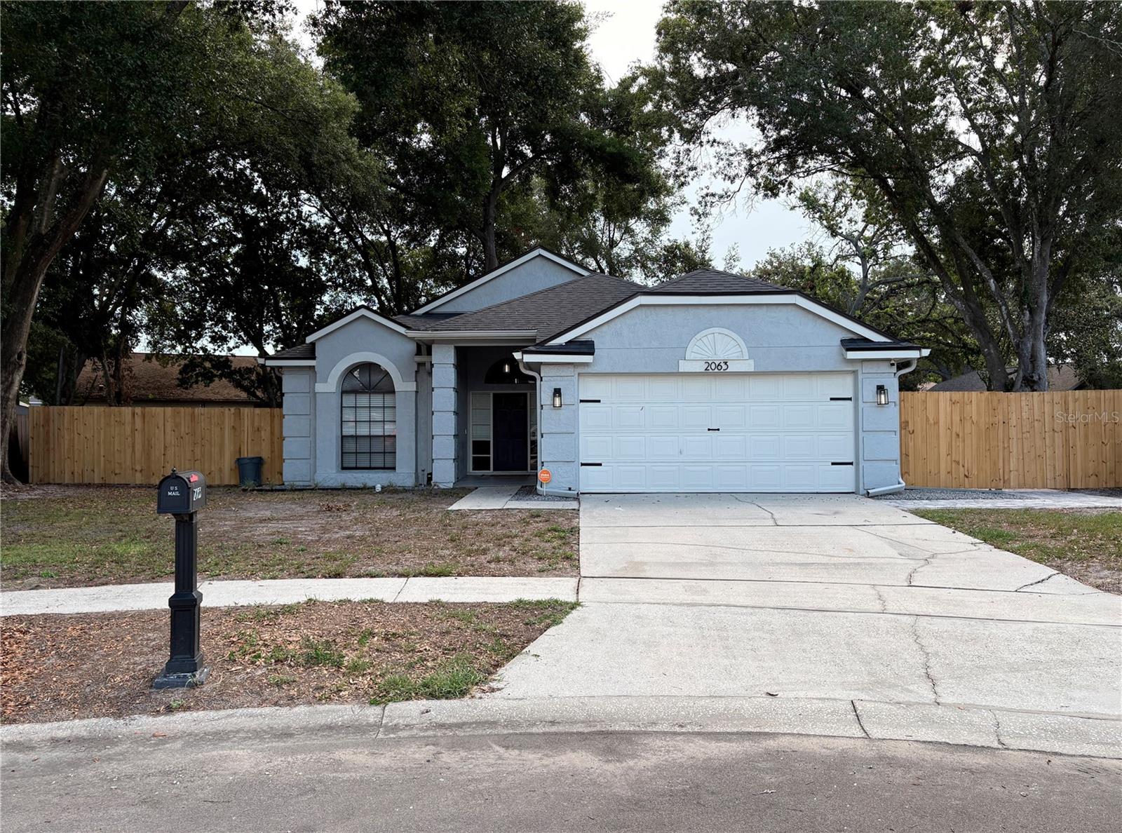 Beautifully updated and move-in ready! This well-maintained 3-bedroom, 2-bath home sits on an oversized 0.28-acre lot and offers a spacious open-concept layout with modern finishes throughout. Recent improvements include a NEW roof (2023), electrical panel upgrade, gutters installed in 2022, A/C system replaced in 2020, whole-home plumbing replaced in 2023, water heater replaced in 2023, whole-yard irrigation system installed in 2021, and a Vivint security system with cameras for added peace of mind. Many additional updates throughout make this home truly move-in ready.

The open living spaces feature soaring cathedral ceilings, skylights, abundant natural light, and durable wood-look tile flooring throughout the main areas. The remodeled kitchen offers white shaker cabinetry, granite countertops, a large center island with seating, stainless steel appliances, built-in microwave and oven, and a modern backsplash. The kitchen flows seamlessly into the main living areas, creating a functional space for everyday living and entertaining.

The family room features a white brick fireplace and built-in wet bar with glass cabinetry, wine rack, and beverage cooler. A sliding glass door provides access to the screened patio and backyard.

The spacious primary suite includes a walk-in closet with custom built-in organizers and a remodeled en-suite bathroom featuring a freestanding tub, glass-enclosed shower, double vanity, and modern finishes. The secondary bedrooms offer vaulted ceilings, upgraded flooring, and unique arched windows. The guest bathroom has also been updated with modern fixtures and finishes.

Outside, enjoy a large fully fenced backyard with mature trees, a screened patio, and brick-paver area perfect for outdoor dining, grilling, and relaxation. The garage features professionally finished epoxy flooring.

Conveniently located near shopping, dining, schools, and major roadways, this home offers a great combination of comfort, upgrades, and outdoor space. Schedule your private showing today!