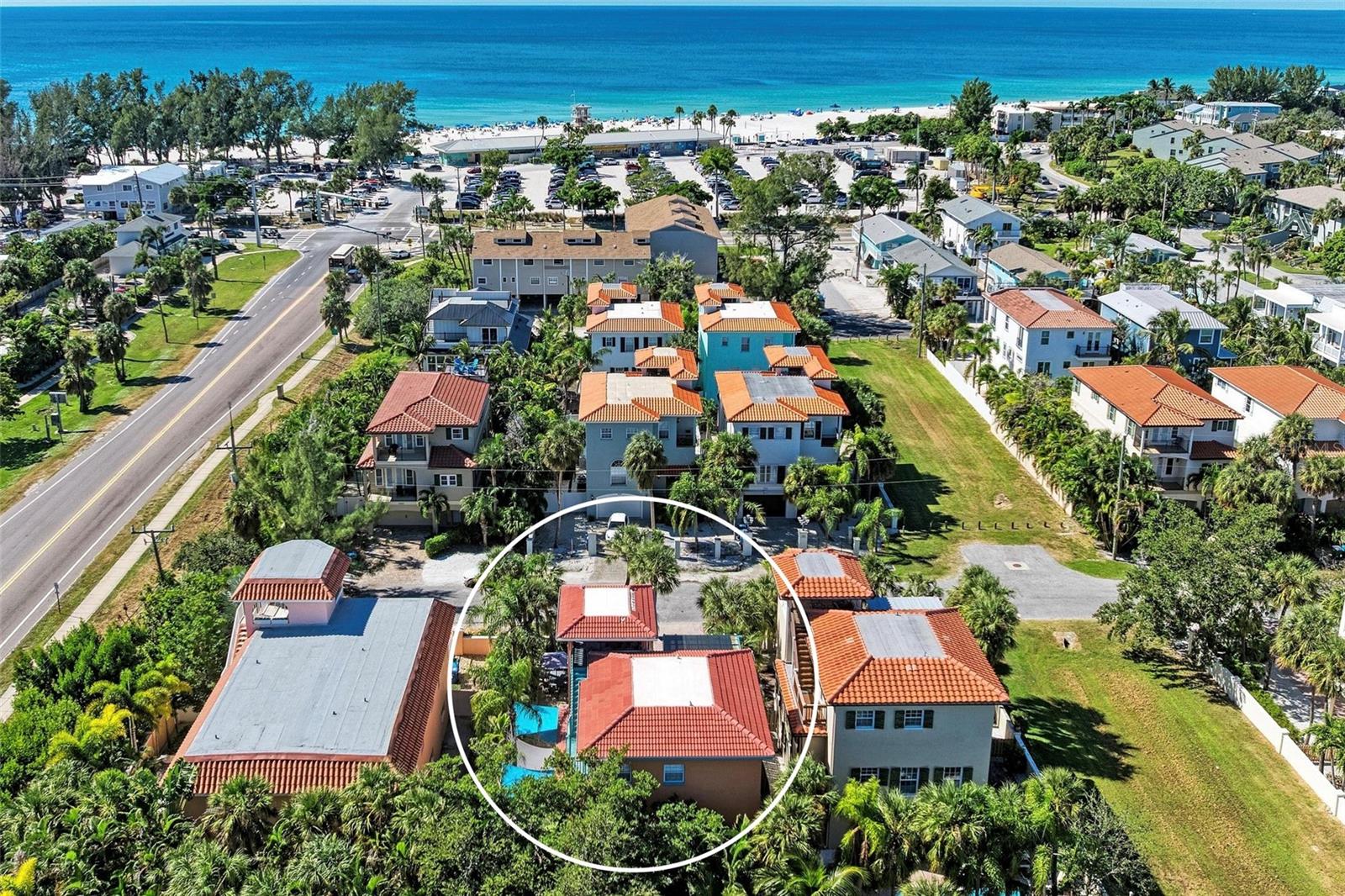 Mediterranean-inspired coastal luxury just one block from the Gulf—this fully furnished, elevated single-family villa, “Island Oasis,” offers no HOA, complete privacy, and proven storm resilience with no damage to upper living areas. Solid construction, turnkey condition, and major system updates provide immediate peace of mind, especially with income projections between 153-193k annually, for those interested in renting.

This exceptional Anna Maria Island retreat comfortably accommodates 8+ guests, featuring two king suites, a third bedroom suite with two queen beds, and additional sleeping space in the great room—ideal for personal use, multigenerational living, or income-producing potential. Recent upgrades include new roof (2024), refrigerator (2024), dishwasher (2025), washer/dryer (2024), AC units (2020 & 2017), and water heaters (2025 & 2019), along with a resurfaced pool with new coping, pavers, heater, and pump.

Inside, the home showcases light-filled interiors, soaring ceilings, crown molding, and natural wood accents, blending refined coastal design with relaxed island comfort. The open-concept kitchen features wood cabinetry, tile backsplash, an eat-at island, and newer stainless appliances, flowing seamlessly into the main living and dining areas. Glass sliders open to a front piazza and private pool courtyard, creating effortless indoor-outdoor living.

The primary suite offers a private balcony and a spa-style bath complete with a clawfoot soaking tub and walk-in shower, delivering a true owner’s retreat. Above it all, a rooftop terrace captures 360° sunrise and sunset views, with peek-a-boo Gulf and Bay views, setting the stage for unforgettable evenings in the delightful island breeze.

Step outside and experience the Florida lifestyle—sun-drenched pool days, shaded terraces, and lush tropical landscaping create a private oasis just moments from the beach. A short walk leads you to the soft white sands of the Gulf, while nearby favorites like Skinny’s, Manatee Beach, Pine Avenue, boutique shopping, waterfront dining, and the free island trolley make island living effortless.

Elevated, meticulously maintained, and offered fully furnished, this is a rare opportunity to own a resilient, income-capable coastal home in one of Florida’s most sought-after destinations.

Anna Maria Island living at its finest—sun, sand, and effortless coastal luxury await.