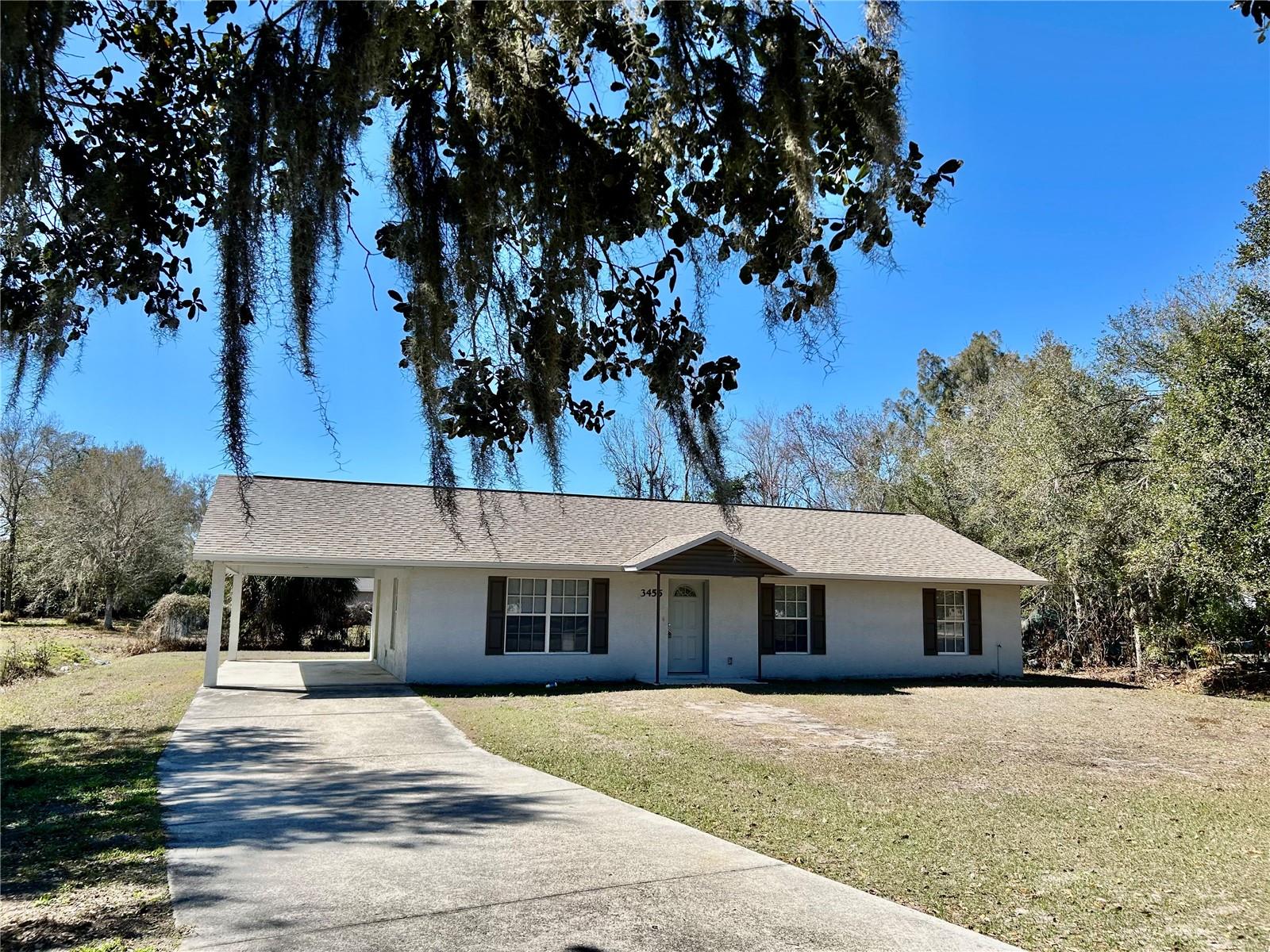 Move in ready! This home in Zolfo Springs boasts a prime location! Just half a mile from Pioneer Park, you'll have easy access to the Peace River for canoeing, kayaking, fossil hunting, picnicking, playground fun, Wildlife Refuge and camping. The county seat of Wauchula is only 4 miles away, with the charming town of Arcadia just a 20-mile drive. This concrete block home features a master bedroom with an en-suite bath and walk-in shower, plus two additional bedrooms and a guest bath with a tub and shower combo. The open floor plan provides views from the living room to the dining room and kitchen, while a spacious utility room offers plenty of workspace and access to the carport. The yard is shaded by mature oak trees, adding to the home's appeal. A new roof was placed in January 2026.