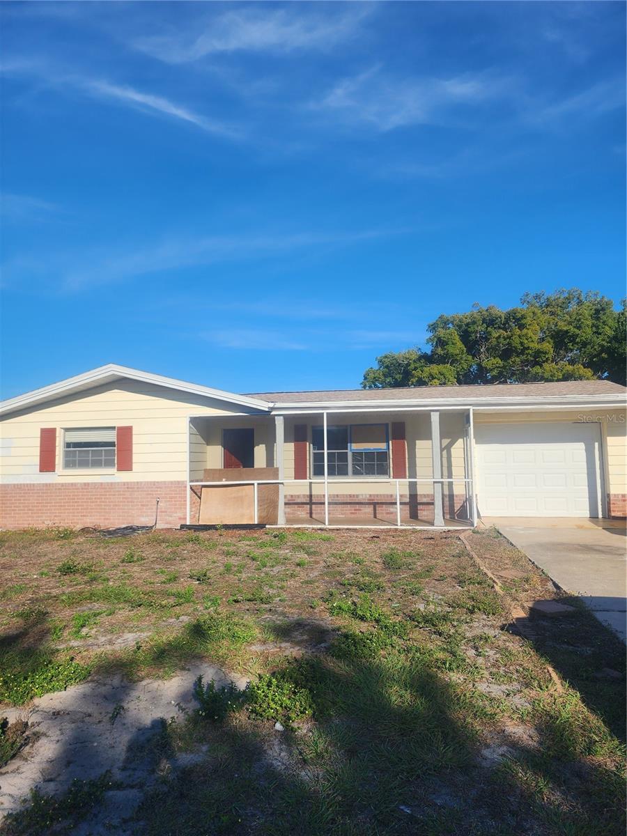 Welcome to this 3 bedroom, 2 bathroom home in Holiday, FL that is PRICED TO SELL!  Great location just two miles from the Gulf of Mexico and minutes from the famous Clearwater Beach with NO FLOOD INSURANCE REQUIRED. This is the perfect home for buyers looking to build equity value while making the home their own.  With some light cosmetic rehab like replacing the carpet, new paint ect , this home will be looking new again in no time! It already has a beautiful kitchen with stainless steel appliances and a renovated bathroom with porcelain tiles, wood vanity and granite countertops! Seller says sell as-is with no repairs, so make this your opportunity to get an great house at an amazing price!