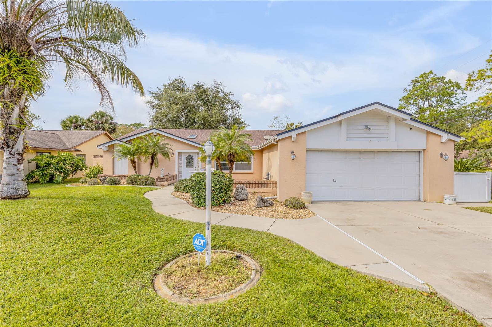 Welcome to your new home! This beautiful home is located on a corner lot with great curb appeal. The large screened in lanai supplies plenty of space for outdoor seating and is the perfect oasis for entertaining. This 2 bedroom 2 full bath homes offers a large grand living room, eat in kitchen, indoor laundry space, and a spacious bonus room, that would be perfect for an  office or third bedroom. Ceramic tile and vinyl flooring throughout the entire home, window treatment remain as well.  This home has a 2 car garage as well as a large shed for all the extras. Located just 18 minutes from Flagler Beach and 15 minutes from Grand Haven Golf Club, providing that Florida living experience. To top it all of- NO HOA! Schedule your showing today and make this your home.
