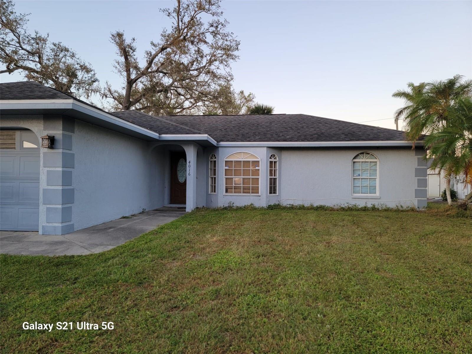 Location, location, location! This 3 bedroom, two bath, two car garage, screened lanai home, located within a 5 minute walk to the local popular mall is one you won't want to miss. Enjoy your breakfast from your eat in kitchen that overlooks natures of beautiful oak trees.