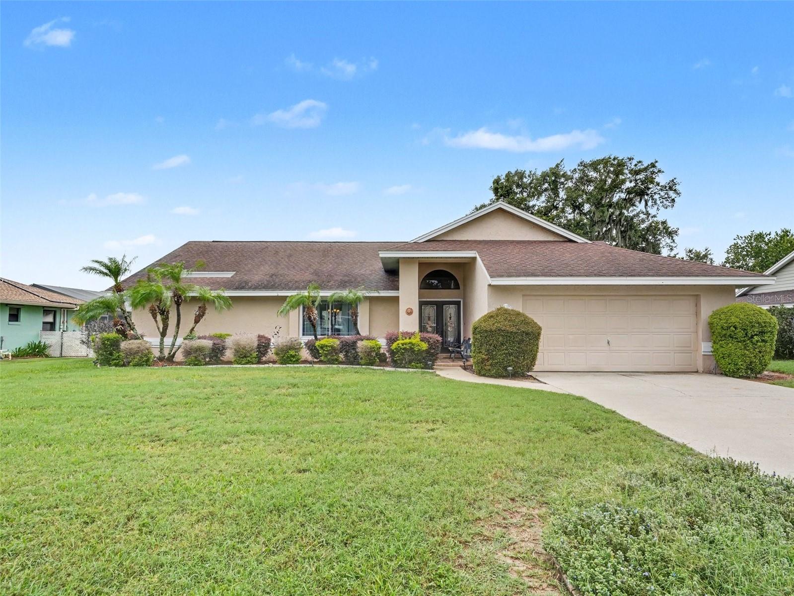 SE WINTER HAVEN CHARMER! Welcome to this spacious 3BR/2BA home perfectly situated on a generous .34-acre lot in a highly sought-after neighborhood. Boasting nearly 1,900 sq. ft. of comfortable living space, this residence features a functional open floor plan, bright living areas, and an attached garage. Step outside to your expansive backyard with plenty of room to roam. Incredible location just off Helena Rd, minutes from the Chain of Lakes, dining, shopping, and Legoland!