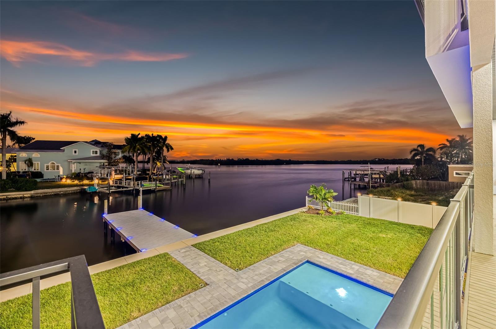 NEW PRICE! Luxury Waterfront New Construction with Open Tampa Bay Access

Experience the pinnacle of waterfront living at 2121 Bayou Grande Blvd NE, a spectacular custom-built estate offering over 5,800 square feet of luxury, breathtaking open water views, and direct access to Tampa Bay and the Gulf of Mexico with no bridges to navigate.

Perfectly positioned on protected water, this exceptional residence combines sophisticated architecture, designer finishes, and a floor plan tailored for both grand-scale entertaining and everyday living. Featuring five bedrooms, five full baths, two half baths, a private elevator serving all levels, two expansive garages with space for up to eight vehicles, impact-rated windows and doors, and a whole-house generator, every detail has been thoughtfully curated to deliver an unparalleled waterfront lifestyle.

The heart of the home is an impressive great room designed to maximize natural light and showcase stunning water views. Entertain effortlessly with a stylish wet bar featuring a wine cooler and ice maker, while the chef's kitchen is appointed with premium Wolf natural gas appliances, quartz countertops, an oversized center island, custom cabinetry, and a concealed walk-in pantry. A formal dining room, private office, climate-controlled wine room, and a private guest or multigenerational suite complete the main living level.

Upstairs, the luxurious owner's retreat offers sweeping open water vistas, a custom-designed walk-in closet, and a spa-inspired bath featuring a freestanding soaking tub, dual vanities, and an oversized glass-enclosed shower. A spacious game and media room opens to a waterfront balcony, creating the perfect setting for enjoying spectacular sunrises and evening sunsets over the bay.

Outdoor living is equally impressive, highlighted by a heated resort-style pool and spa, fire pit, expansive entertaining areas, and a newly constructed dock providing immediate access to world-class boating, fishing, and waterfront destinations throughout Tampa Bay and the Gulf. Whether hosting guests or enjoying a quiet evening by the water, the setting is designed to embrace Florida's year-round coastal lifestyle.



Why spend years navigating the design and construction process when you can move directly into a completed luxury waterfront masterpiece? Located in one of Northeast St. Petersburg's most prestigious waterfront neighborhoods, this extraordinary estate offers the rare combination of brand-new construction, exceptional craftsmanship, protected deep-water access, expansive garage capacity, and the sophisticated coastal lifestyle that discerning buyers seek.