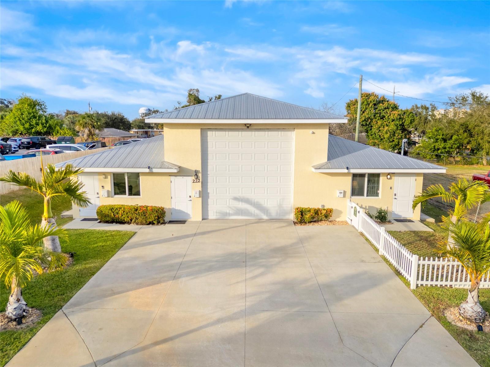 Attractive & homey, well-maintained, single-owner investment property w/ happy tenants & very low vacancy. Commercial contractor/owner built in 2018 & located a third of a mile away from the energy of Cocoa Village! This four-unit income compound sits on a .32-acre fully fenced parcel, offering privacy, security & controlled access. Unit A is a 6-month lease: $1,500/mo. (tenant willing to stay or vacate @ closing), Unit C is an Airbnb: 81 nights in 2025 earned $13K (family/friends occupied remainder of the year; could be $30K if rented 50% of the year!)- Unit B is used as a motor-coach storage garage & engineered w/ full plumbing, electrical, HVAC & commercial-grade infrastructure to allow conversion into a 2-story living space if desired. The rear 2/2 cottage is operating as an annual rental and includes a private outdoor living area & is situated within the property's fully fenced grounds. The center unit is perfect for the boat, or car enthusiast!