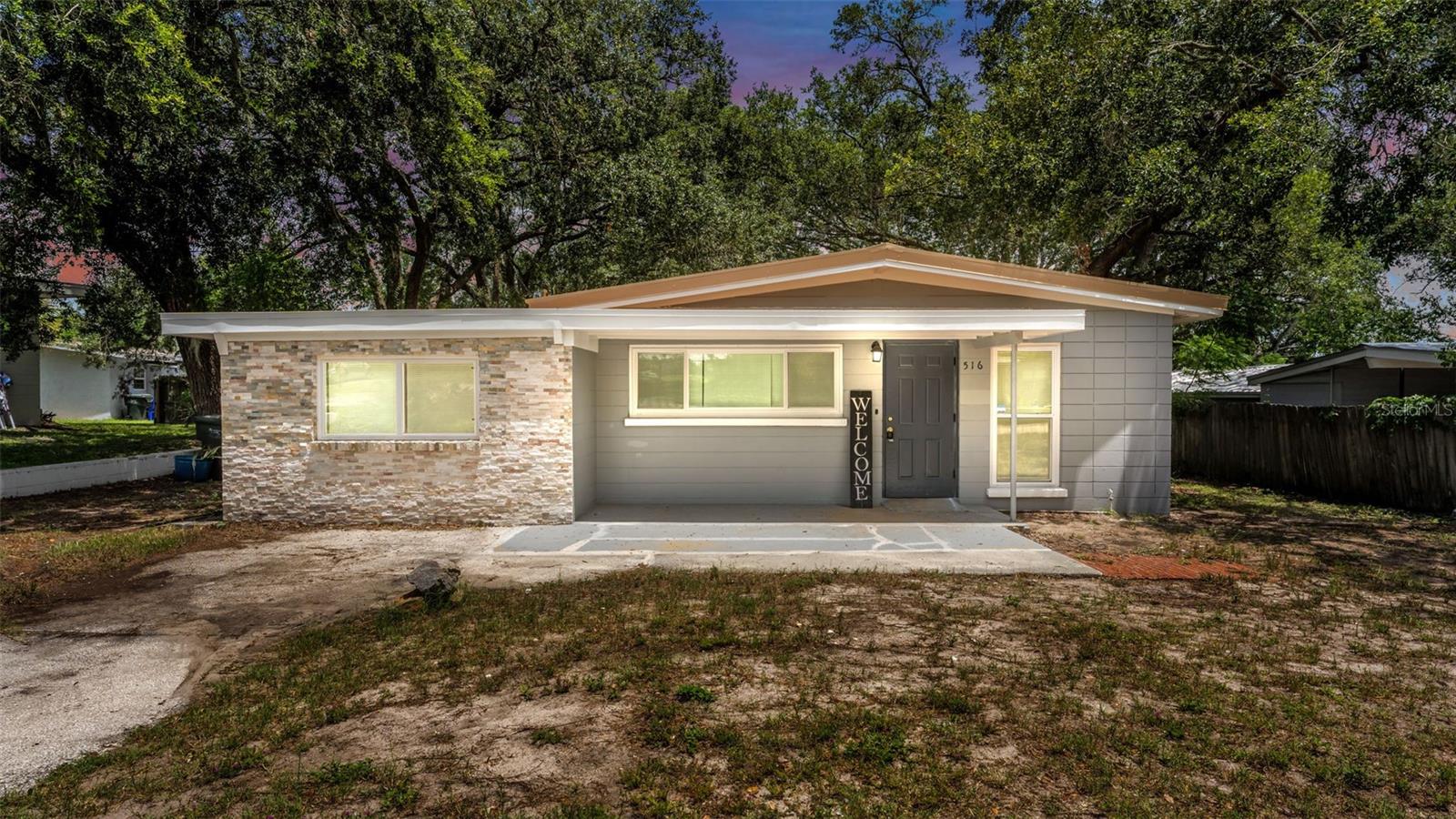 This charming and updated Mid-Century Bungalow is the perfect place to call home! Inside you'll find the family room, kitchen with new cortez countertops, brand new lower cabinets, new garbage disposal, new sink, and a new dishwasher.  There are 3 bedrooms, 1.5 baths, PLUS a large bonus room with its own private enterance on the left side of the home. It would make a great bedroom for a teen, a gym, MIL suite, or office, the possibilites are ENDLESS! The laundry room is also located in this bonus room. Fresh new paint inside, new light mirror in half bath, shower has smart exhuast fan w/speaker and changes colors, smart dimmer switches throughout, NEW Windows, and NEW Metal Roof.  Located near Cleveland Heights Rd, Lake Hollingsworth, The YMCA, Polk Parkway and tons of restruants, shopping, and entertainment.