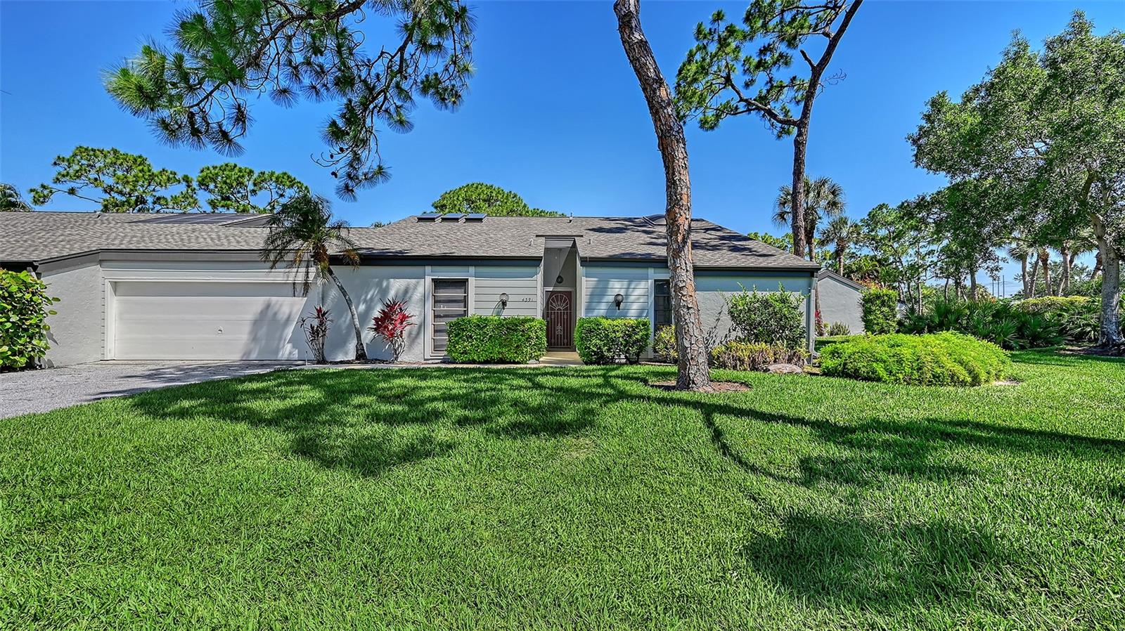 Nestled in the highly sought after community of Woodmans Chart, this 2 bedroom/2 bath villa combines architectural character, abundant natural light, and a resort style lifestyle just 15 minutes from downtown Sarasota and about 30 minutes from world-renown Siesta Key Beach. Soaring vaulted ceilings with striking wood beams create warmth and charm throughout most of the home, while recent interior paint and new plank-style tile flooring add a fresh, modern touch.  The spacious living area also has a sun room adjoining it with a large skylight that basks the area in light, and creates a bright and welcoming gathering space.  A spacious primary suite features a row of French doors that open to the main living area, enhancing the home's airy, open feeling.  What was most likely once an open atrium has been thoughtfully enclosed to create a stunning sunroom featuring three skylights set into the vaulted ceiling. Bathed in natural light and surrounded by two walls of French doors, this inviting space would make an exceptional art studio, reading room, or extra sleeping area for guests. The entire rear of the home is designed to bring the outdoors in, with walls of glass featuring dual four-paneled sliding glass doors and a large picture window overlooking the expansive 35-foot screened lanai-perfect for entertaining, relaxing, or enjoying peaceful garden views. Just off the dining room, a door leads to a private outdoor patio finished with charming brick pavers-an ideal setting for relaxing outdoors in complete privacy, enjoying morning coffee, or soaking up the Florida sunshine. From the patio, you have direct access to the spacious two-car garage, offering both convenience and ample storage. Residents of Woodmans Chart enjoy access to two community pools as well as a private tennis court tucked away among mature trees and lush landscaping, adding to the peaceful, resort-style that makes The Meadows such a sought-after community.  The 1600 acres of The Meadows offers 14 miles of scenic trails and optional memberships to a fitness center, tennis and pickleball courts, a Junior Olympic pool, and golf. 

Everyday conveniences are close at hand, with easy access to premium shopping, dining, and entertainment including The Fresh Market, Whole Foods, UTC Mall, the new Mote Marine Laboratory & Aquarium, and the popular Waterside district in Lakewood Ranch. This central location places the very best of the Sarasota lifestyle right at your doorstep.     

There is a One Time $1000.00 Capital Improvement fee at Closing.