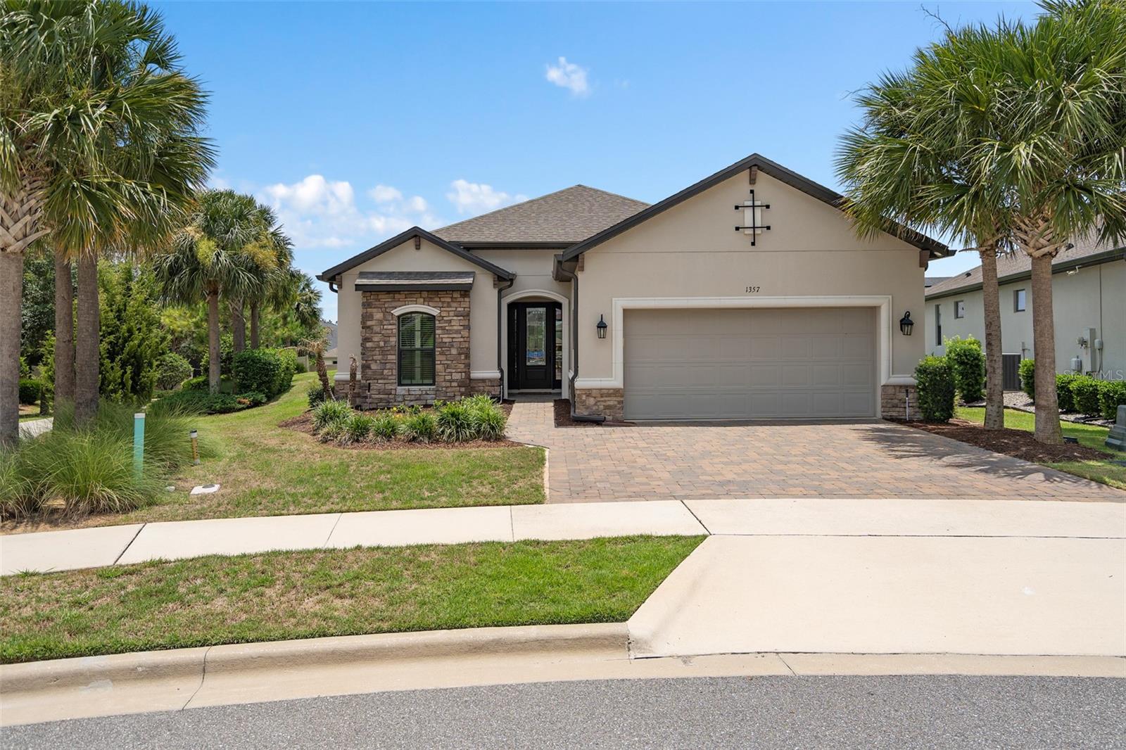 This is the OUTSTANDING LAZIO model you have been LOOKING FOR. Situated on a PREMIUM OVERSIZED LOT in the highly regarded GATED 55+ Community of the Esplanade at Highland Ranch in Clermont. You will also Discover many STRUCTURAL and DESIGN UPGRADES. Upon entry through the SARATOGA GLASS ENTRY DOOR you will be greeted by an ABSOLUTELY GORGEOUS OPEN SEE THROUGH Floor Plan. This 3 Bedroom, 3 Bath, 2,420 sq ft ONE STORY LAZIO has GENEROUS room sizes. The Open KITCHEN with the GOURMET UPGRADE features BUILT-IN UPGRADED CAFE' and Bosch Stainless Steel Appliances, Highly Upgraded LEATHERED GRANITE Countertops throughout, Roll Out Shelves, Under Counter Double Trash Roll Out, Natural Stone Back Splash, Pendant Lighting over a BEAUTIFUL ISLAND and BREAKFAST BAR. You will also appreciate the 42" solid wood upgraded cabinetry throughout the home. The Kitchen Cabinets features Oversized Crown Molding and UNDER CABINET LIGHTING. A LARGE CORNER Walk-In PANTRY allows for great storage. You are sure to be impressed with the GENEROUS size of the Primary Suite with a Tray Ceiling and CROWN Molding. The Primary En-Suite offers a Large WALK-IN SHOWER, Comfort Height DOUBLE SINK vanity, Separate Water Closet and an OVERSIZED WALK-IN CLOSET with Organizers. Bedroom 2 has its very own En-Suite for the convenience of your guests and Bedroom 3 is adjacent to Bathroom 3. There is also an additional Flex Space that can accommodate a Office/Den/Study or a separate sitting room. The LAUNDRY Room includes the Washer, Dryer, Cabinetry for your storage needs and pre-plumbing for a laundry sink if desired. Some of the offered upgrades are UPGRADED Ceramic Tile in the Main Living Areas, and all Bathrooms.  Upgraded 10 FOOT CEILINGS, 8" Interior Doors, Tray Ceilings in the Foyer, Great Room and Primary Suite, Custom Wall Woodworking in the Foyer, Dining Area and a Shiplap wall in the Great Room, Oversize Trim, CROWN MOLDING Throughout the Main Living Areas and Flex Room, PLANTATION SHUTTERS in the Bedrooms, Floor Receptacle in the Great Room, Upgraded Cabinetry throughout, "A" Exterior Elevation, Rain Gutters, R-38 Ceiling Insulation, Foam Filled Insulation in the Block Walls in the Living Areas, Insulated Overhead Garage Door, Comfort Height Toilets Throughout, Additional Ceiling Lighting, Ceiling Fans, 3 CAR TANDEM GARAGE with Ceiling Storage Racks, Generator Outlet, and an UNDER ROOF LANAI with a PAVER PATIO extension. The South facing large rear yard would be perfect for your private pool if desired. RESORT STYLE Community Amenities include Clubhouse, Pool, Spa, Resistance Pool, Clay Tennis and Bocce' Courts, 4 Pickle Ball Courts (Sports Courts are light for nighttime play), Fire Pit, Movement Studio, Activities, Clubs, Billiards & more. Don't forget the DOG PARK for your furry family members too! Close to the New Advent Health Hospital, SOUTH LAKE HOSPITAL, VA, Medical Offices, NTC (National Training Center), SHOPPING & DINING. Miles of Biking/Walking Trails for your Outdoor Endeavors and a 15 minute drive to either Downtown Clermont or Winter Garden for more enjoyment and Farmers Market's. For your traveling convenience, The Esplanade at Highland Ranch is a few minutes to the Florida Turnpike where OIA and Attractions are about 35 minutes away, as well as Dr Phillips Famed Restaurant Row. HOA includes Lawn/Shrub Care, Fertilizing, Irrigation maintenance as well as the Amenities. THIS HOME IS AN ABSOLUTE MUST SEE! The Esplanade at Highland Ranch does NOT have a CDD