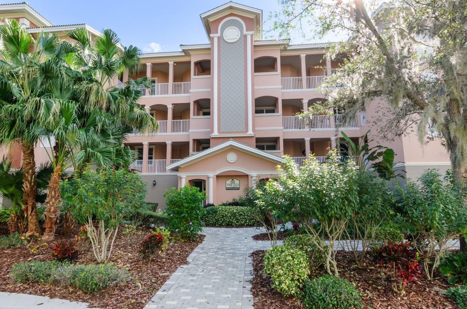 COMPARE PRICE, LOCATION and ASSOCIATION FEES of this LUXURY condo to any EQUIVALENT condo, you will be CONVINCED his condo should be your number ONE choice. This RARELY available FULLY FURNISHED, LARGE END UNIT, has 3-bedrooms, 3-full bathrooms, and nice open floor plan!  ADD in the IMPACT GLASS sliders on the lanai overlooking the preserve and you have a total of 2727sq ft of living space! Kitchen is very bright with dining area with large windows overlooking the heated pool area and 2 hot tubs. Large inside laundry room has ample storage space, the ENTIRE home has so very much storage space which makes for great organization! Some of the upgrades in this lovely home include high tray ceiling, crown molding, arched openings with columns, neutral tile, engineered hardwood flooring, TILE floors in the living room and kitchen. The kitchen has granite countertops, a dine-in area and breakfast bar, custom wood cabinets with rollouts, built-in desk for convenient use such as cookbooks. The ensuite primary bedroom has a huge, customized, walk-in closet and a large bath with soaking tub, walk-in shower, dual sinks, and stone counters. There are two assigned parking spaces under the buildings' gated garage and an extra air-conditioned, secured storage area. LOCATION, LOCATION, LOCATION! This is a MUST SEE if you are looking for a lavish gated community with WALKING PATHS, MAJESTIC OAKS and a PRESERVE WITH WILDLIFE! GRANDE OAKS PRESERVE offers a fitness center, tennis courts and a clubhouse and resort style heated pool and spa! You could walk to the UTC Mall, or Benderson Park with International rowing facilities. SARASOTA S' INTERNATIONAL AIRPORT is only a short drive. Access to I75 is so close! Downtown Sarasota, St. Armands Circle, for fabulous shopping, world famous Siesta Key beach and Lido Key Beach, cultural activities, numerous golf courses, and medical facilities. Come see and don't miss this beautiful home!