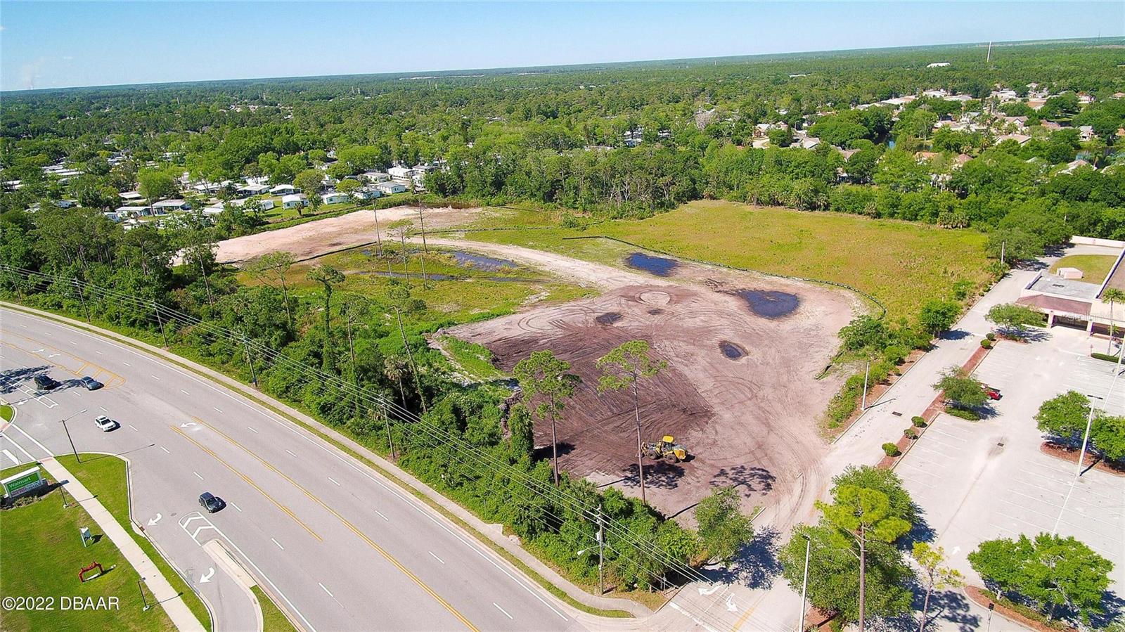 11.8 Acres of Prime Retail/Mini Warehouses in back/Banks/Office/Restaurant/ALF/ & other Mixed Use Vacant Land located in a high density growing area of Port Orange. Clyde Morris road frontage, approximately 800 feet. The properties adjacent and across the street are Retail Centers. This is cleared and compacted Land which has already been mitigated and ready to develop. There are 2 parcels that are included. This is an approved PCD with conceptual plans attached. Parcel ID 630600000126 & Parcel ID 630600000122. 2 parcels with 2 addresses 3830 & 3834 Clyde Morris Blvd
