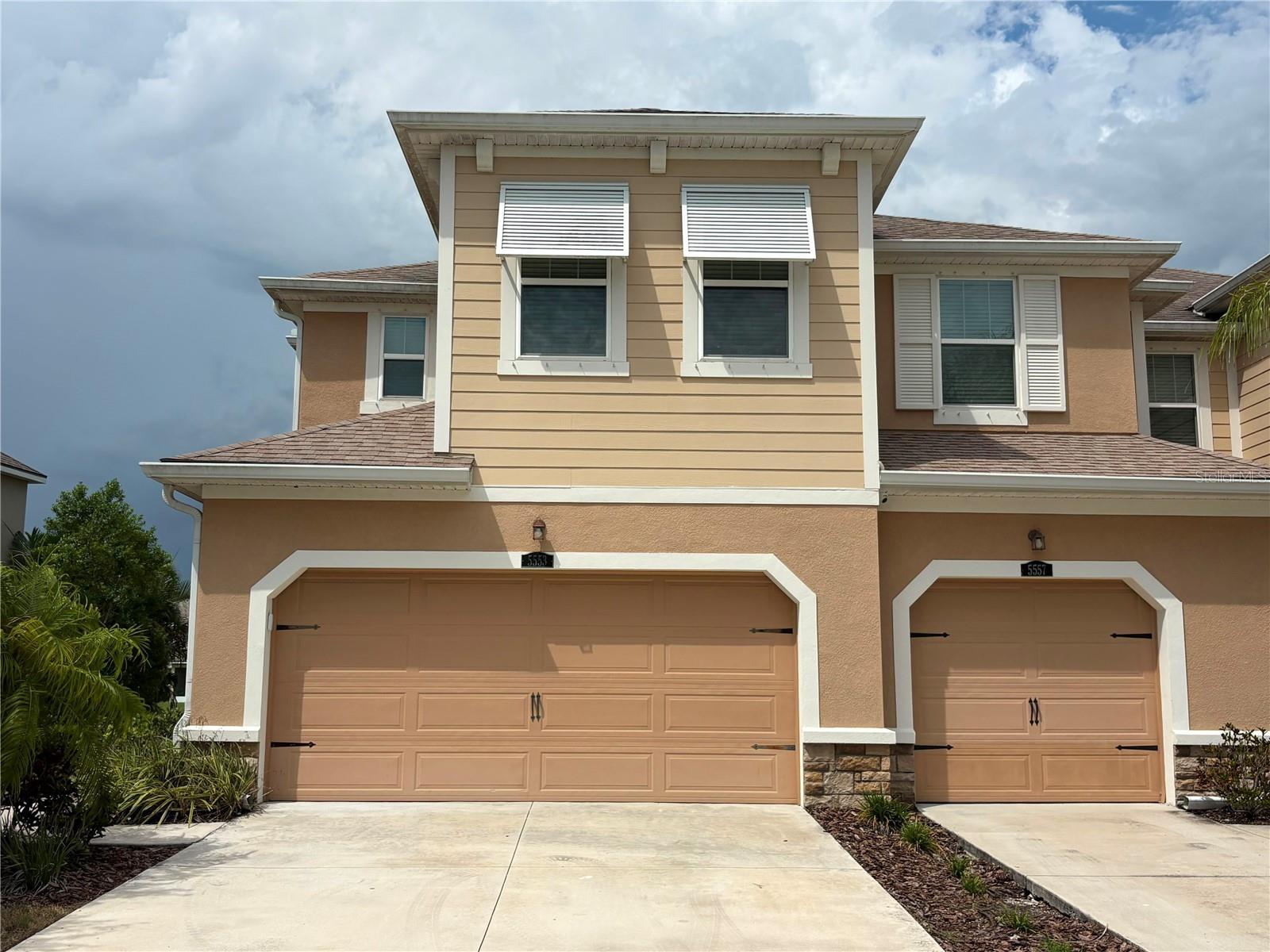 Welcome to this beautifully maintained townhome in the sought-after Harmony at Lakewood Ranch community. Featuring the popular Seaside Craftsman floor plan, this home offers an open-concept design with stylish stone-colored cabinetry, stainless steel appliances, a spacious center island, breakfast bar, and 12x24 tile flooring throughout the main living area. The bright and inviting great room flows seamlessly to the screened private lanai, creating the perfect space for relaxing or entertaining. Upstairs, the spacious primary suite boasts a tray ceiling, dual vanities, a large walk-in shower, and two walk-in closets, while two additional bedrooms, a full bath, and a conveniently located laundry room provide comfort and functionality. Residents enjoy resort-style amenities including a clubhouse, pool, fitness center, playground, and walking trails, all just minutes from shopping, dining, top-rated schools, and the beautiful Gulf Coast beaches.